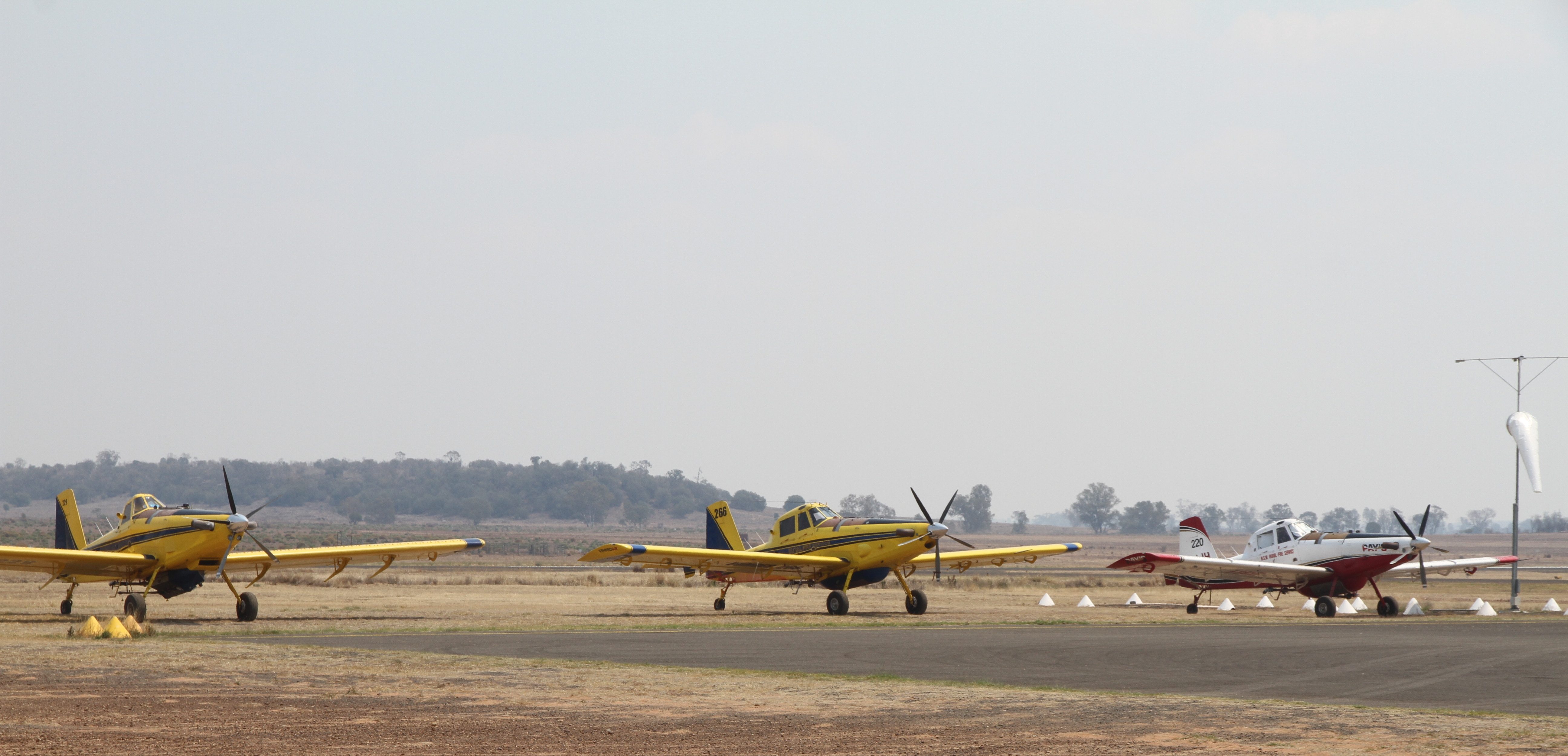 Air Tractor water bombers await tasking at Narrabri Air Base.