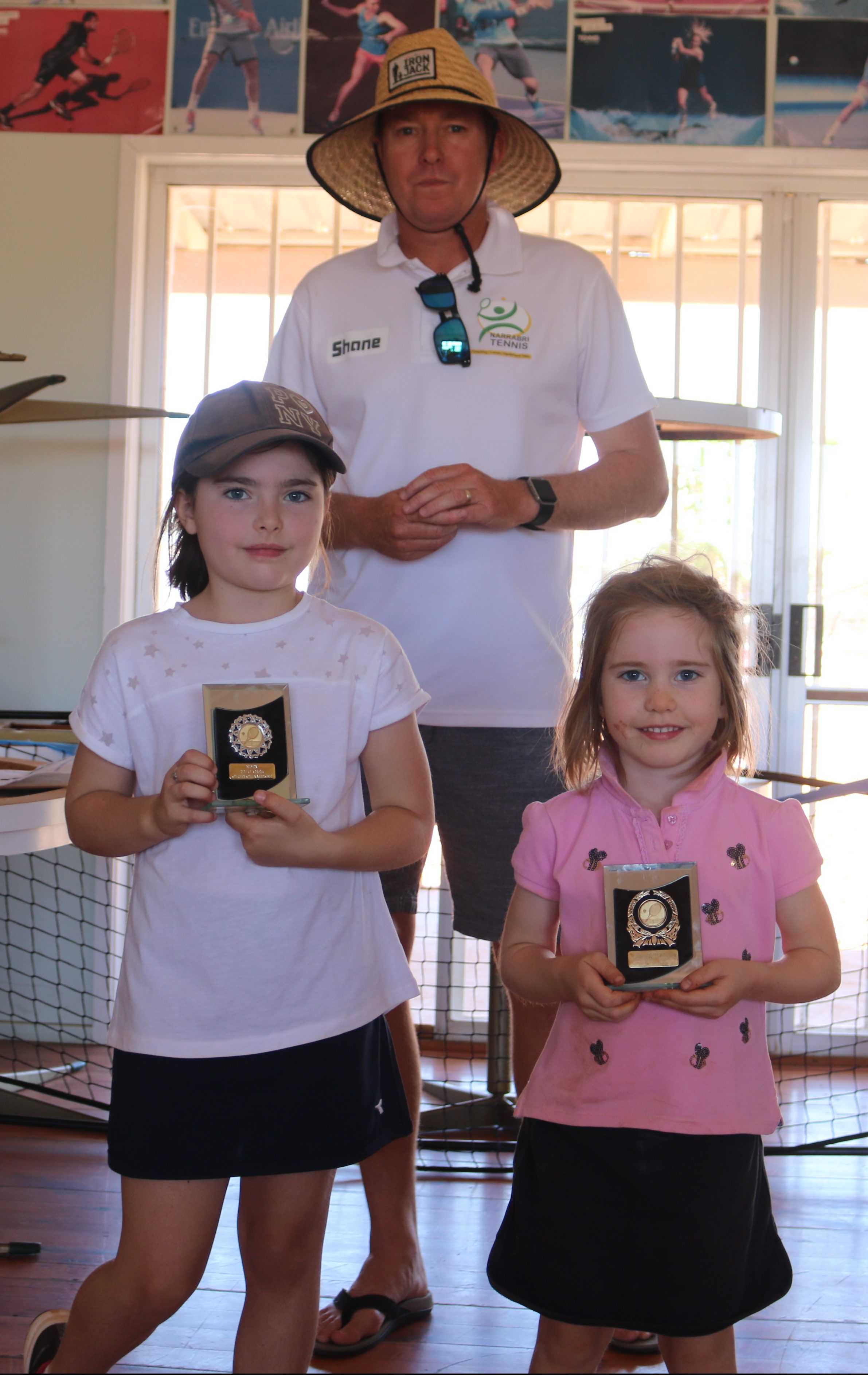 8-and-under girls winner Matilda Murphy and runner-up Anna Murphy with Shane Murphy.