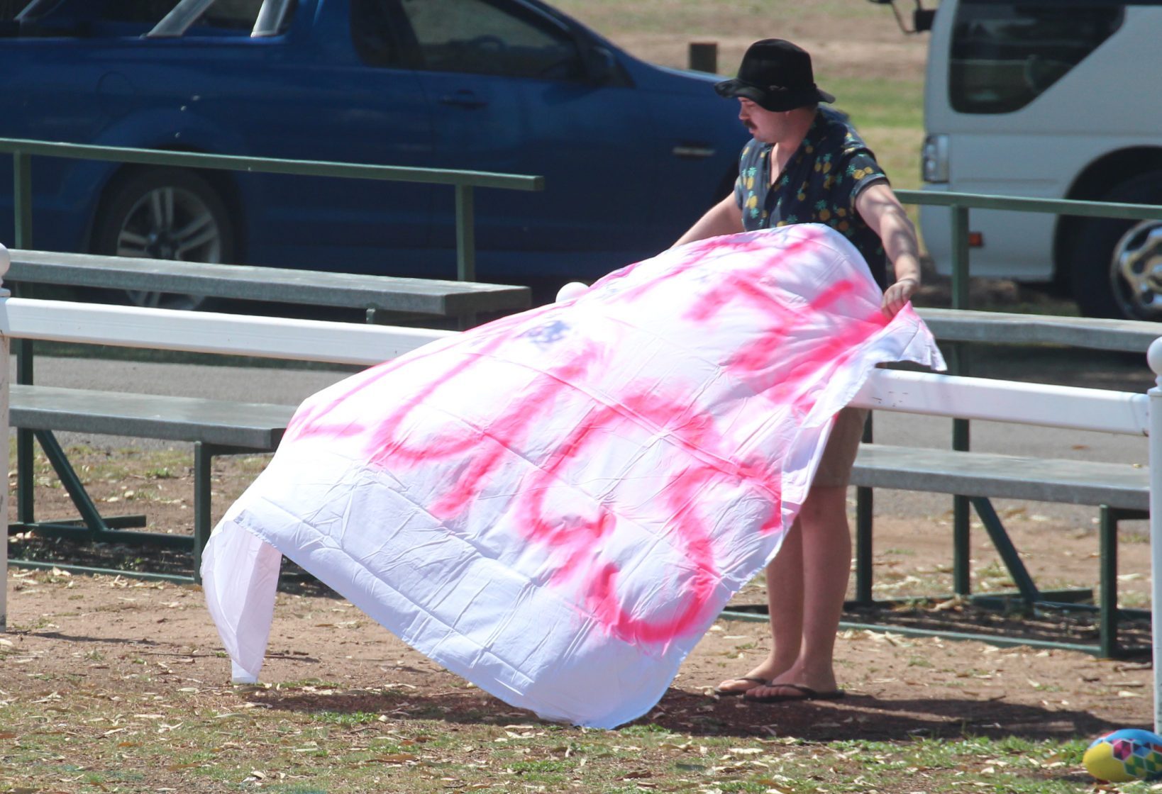Pink Slugs fan Matt Conroy setting up his supporter banner.