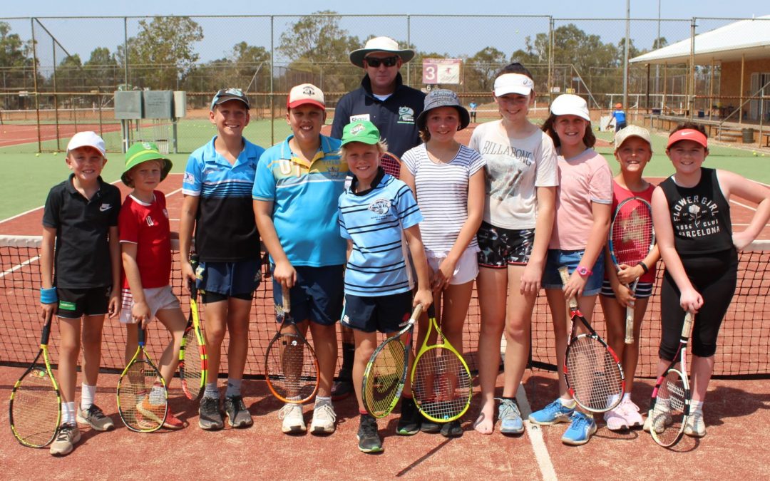 Young tennis aces brace the summer heat at school holiday clinic