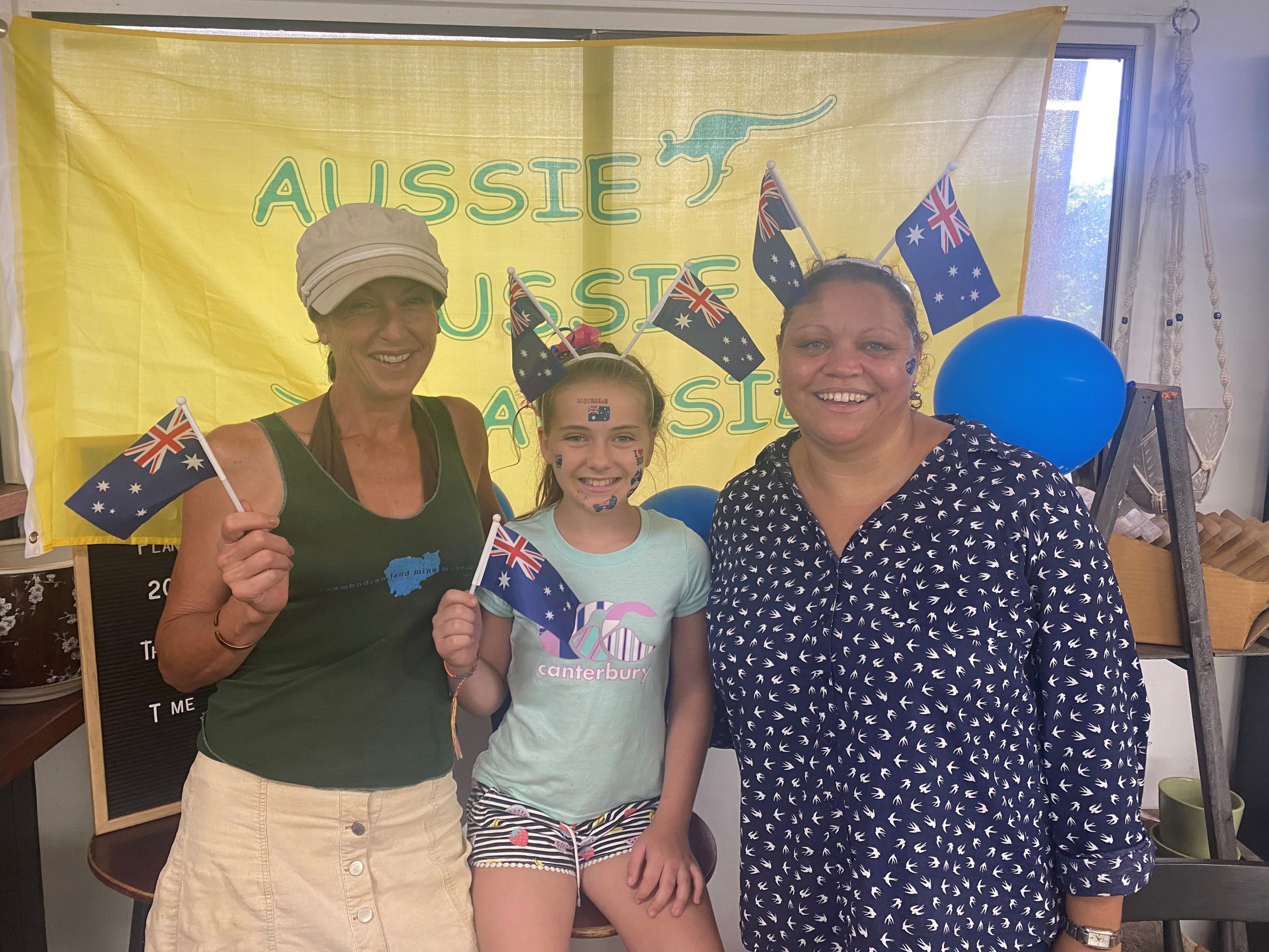 Fiona Oudenryn, Mia Kiem and Olive Morrison dressed up for work at the nursery on Australia Day.