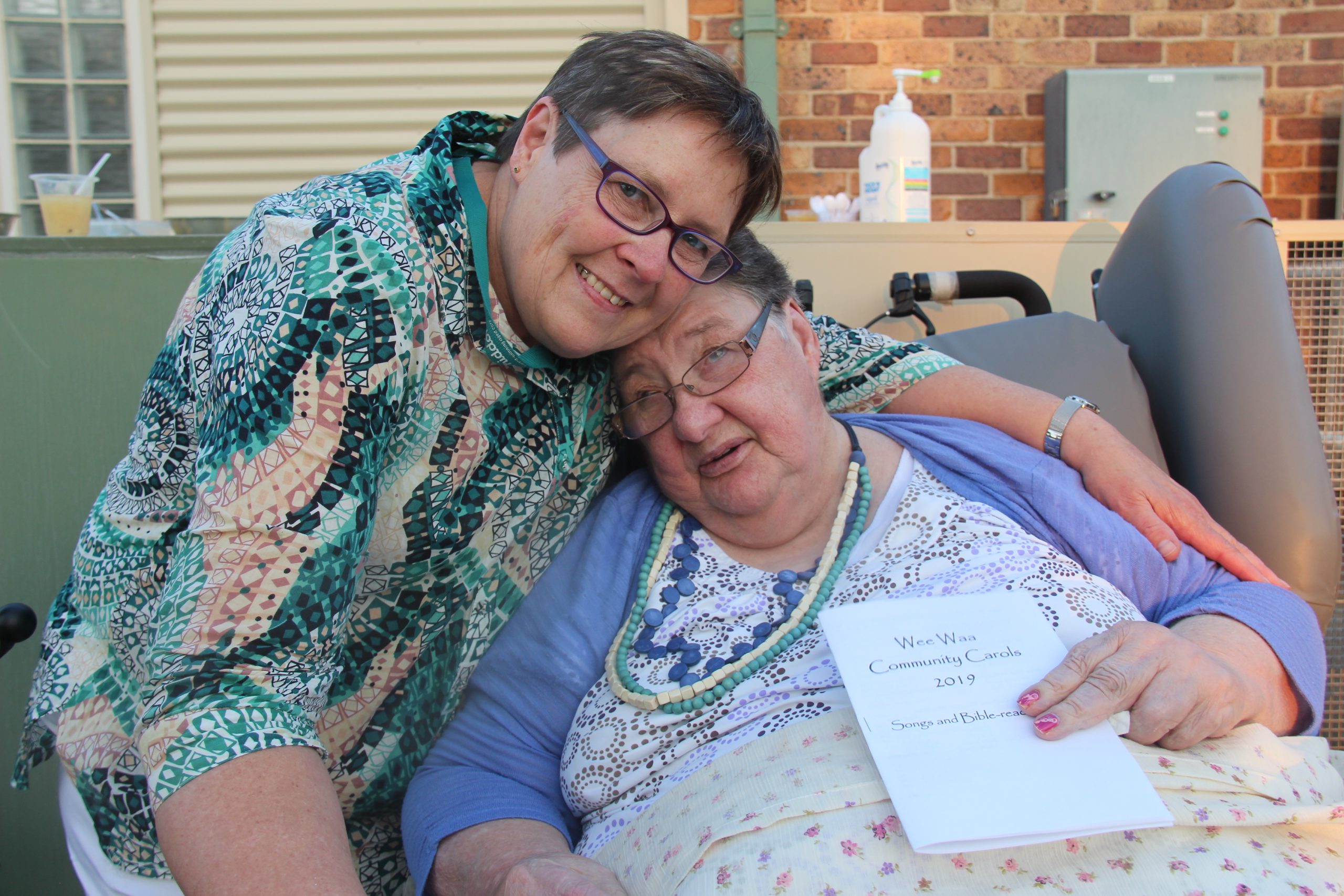Left: Liz Berger and the late Sylvia Radford pictured at the Wee Waa Christmas Carols in 2019.