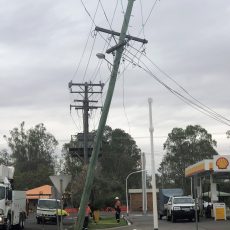 Truck breaks power pole on main street