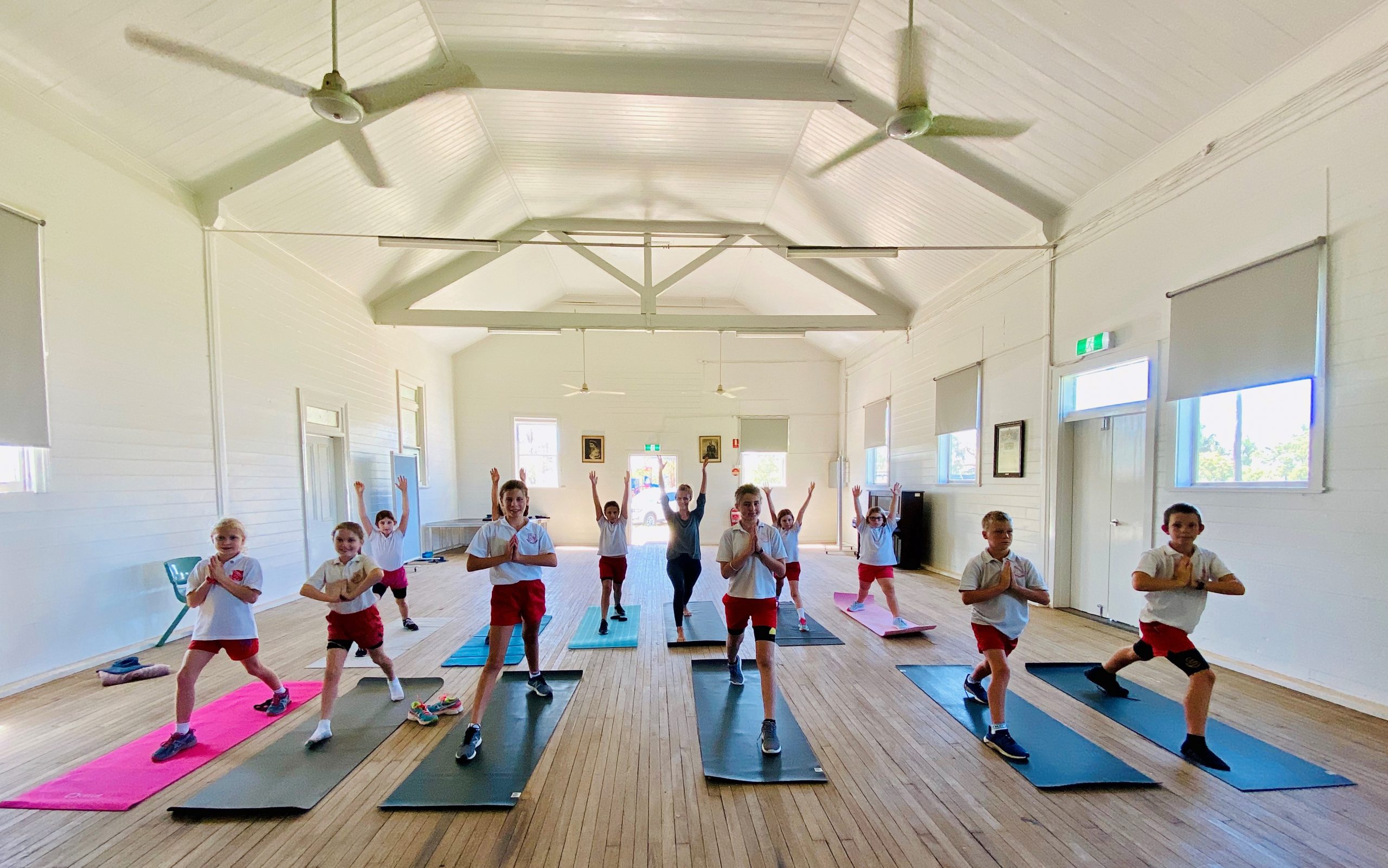 Burren Junction Public School students in yoga and mindfulness practice. Pictured back, Charlie Fisher, Aaron Lane (obscured), Bridie Harris, Kendra Cook, Bec McMahon and Abbey Lilliebridge, front, Sophie Slack-Smith, Sabrina Knight, Zara Marshall, teacher Katy Simshauser, Will Smith and Jock Carolan.