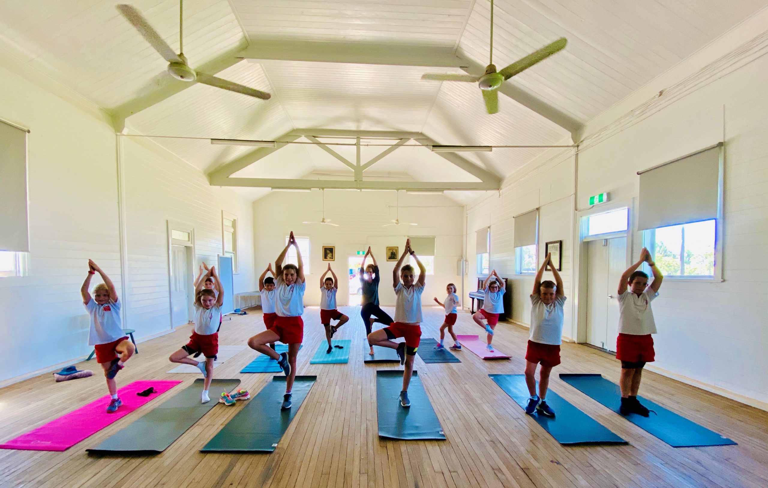 Burren Junction Public School students in yoga and mindfulness practice. Pictured back, Charlie Fisher, Aaron Lane (obscured), Bridie Harris, Kendra Cook, Bec McMahon and Abbey Lilliebridge, front, Sophie Slack-Smith, Sabrina Knight, Zara Marshall, teacher Katy Simshauser, Will Smith and Jock Carolan.