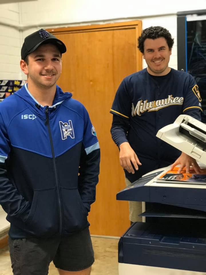 WWHS learning and support officer Lachlan Trindall and teacher Patrick Legge getting work ready for students to take home.