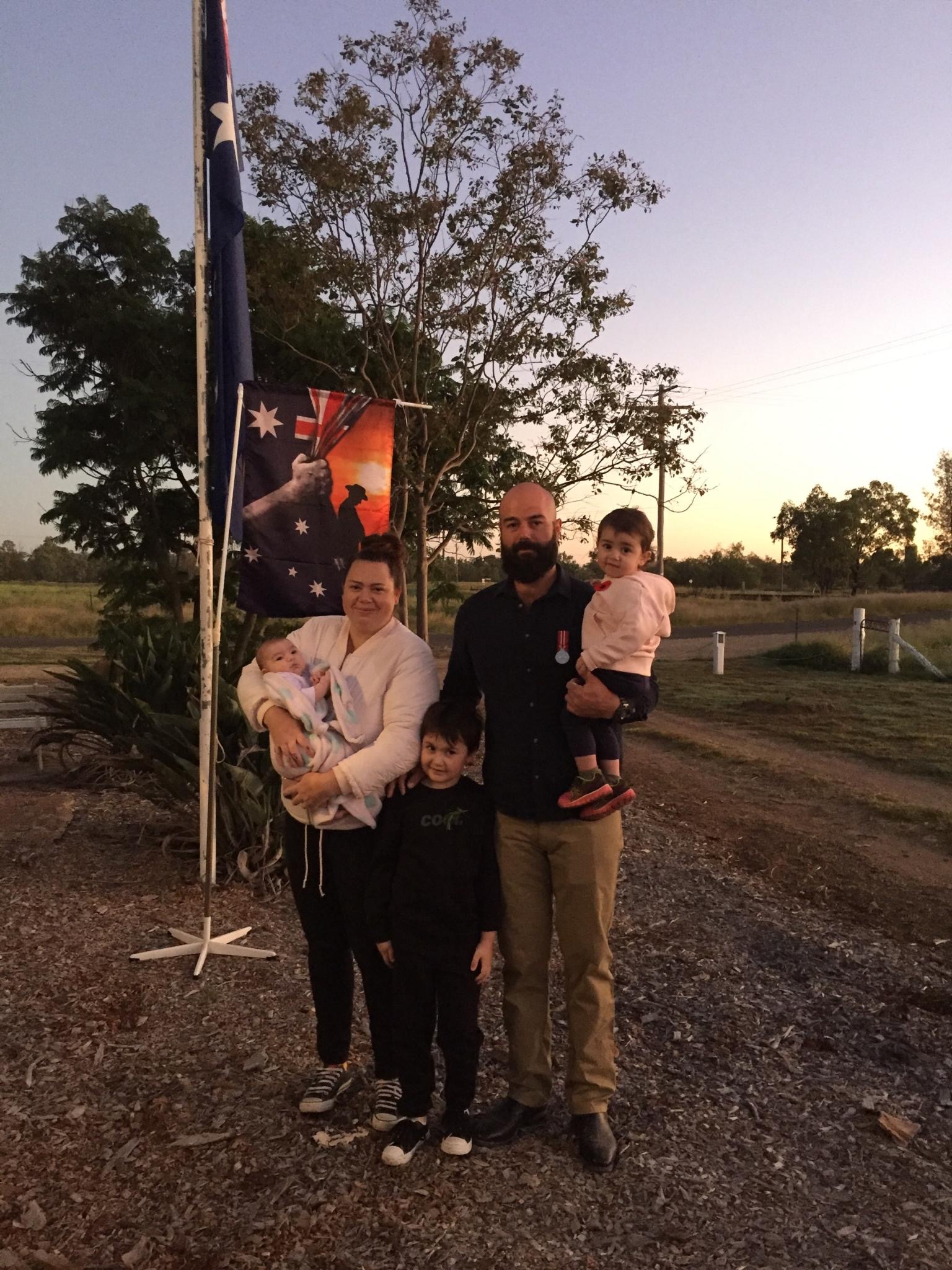 Ex-serviceman Dane Russell with his family, wife Caitlin and children Theodore, Penelope and Matilda.