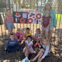 Children at the Wee Waa Nurruby Out of School Hours holiday program proudly displaying their Anzac Day sign. Pictured standing Bree Pillar, Payton Knight and WWOOSH educator Anita Wright, sitting back Celia Galagher, Edom Grebreselassie and Indi Johnson, sitting front, Lincoln Smolders, Jasmine Hastings and Nevaeh Knight.