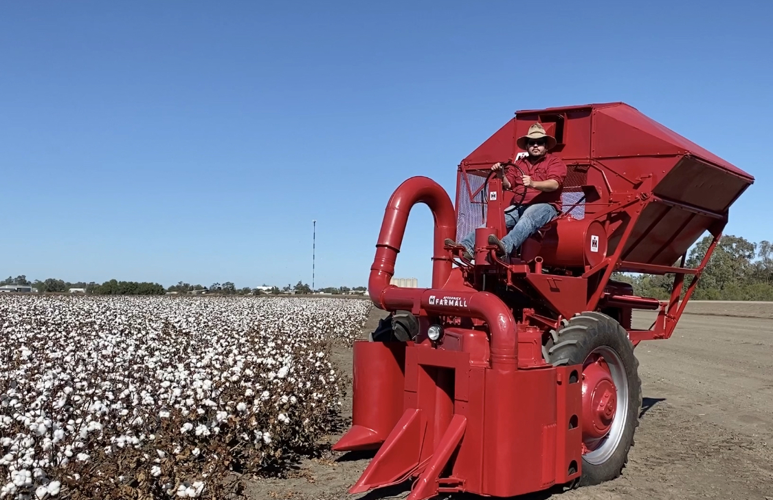 Matt Copelin proudly perched behind the steering wheel of the magnificent, restored cotton picker. The picker was produced in 1948 and is a M-12-H model, International Harvester single row cotton picker.