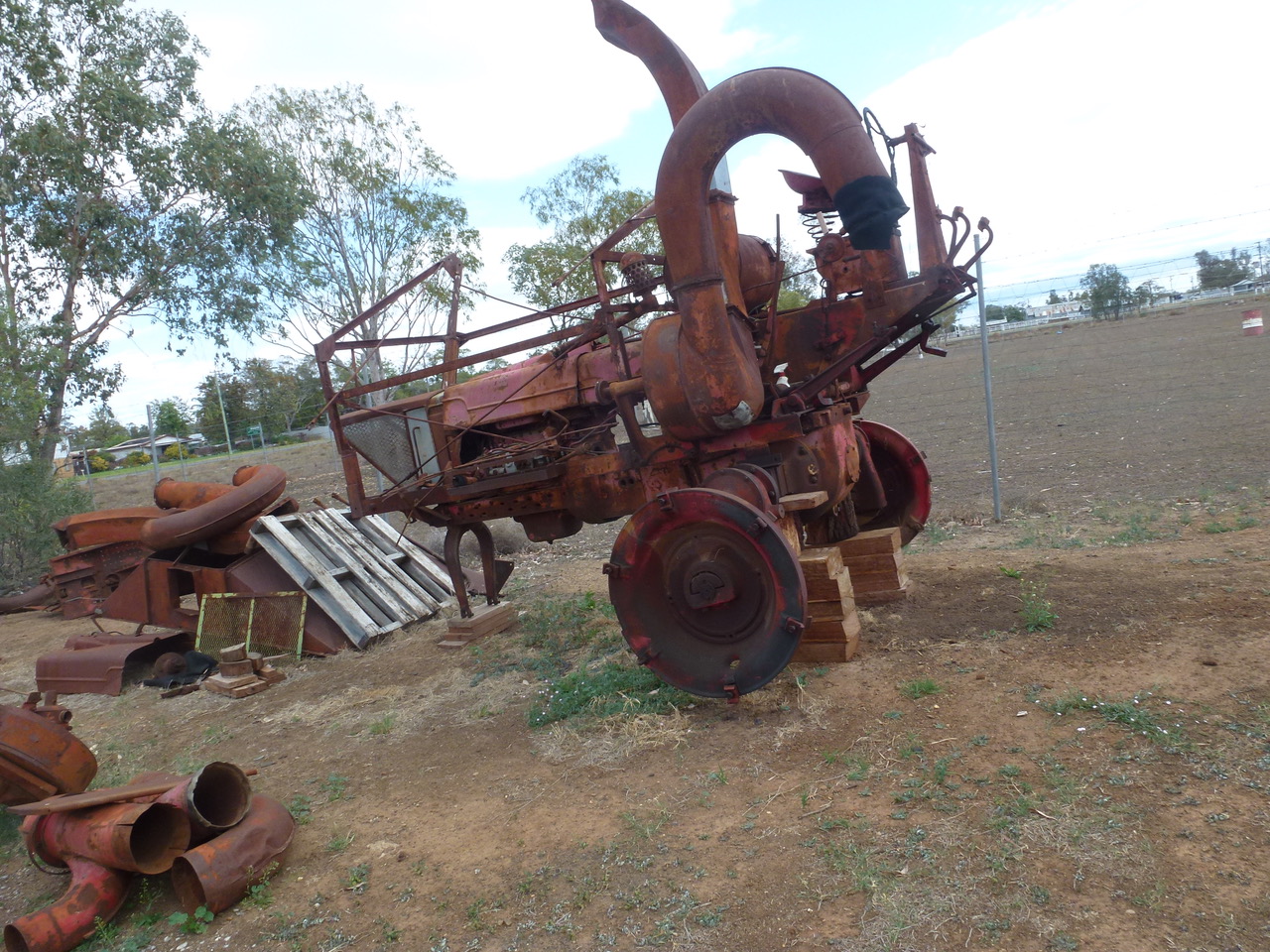 What a transformation: as the photos show, Ronan Revell and an army of workers have transformed the rusty, old cotton picker into what is now a magnificent, bright red and fully restored machine. 