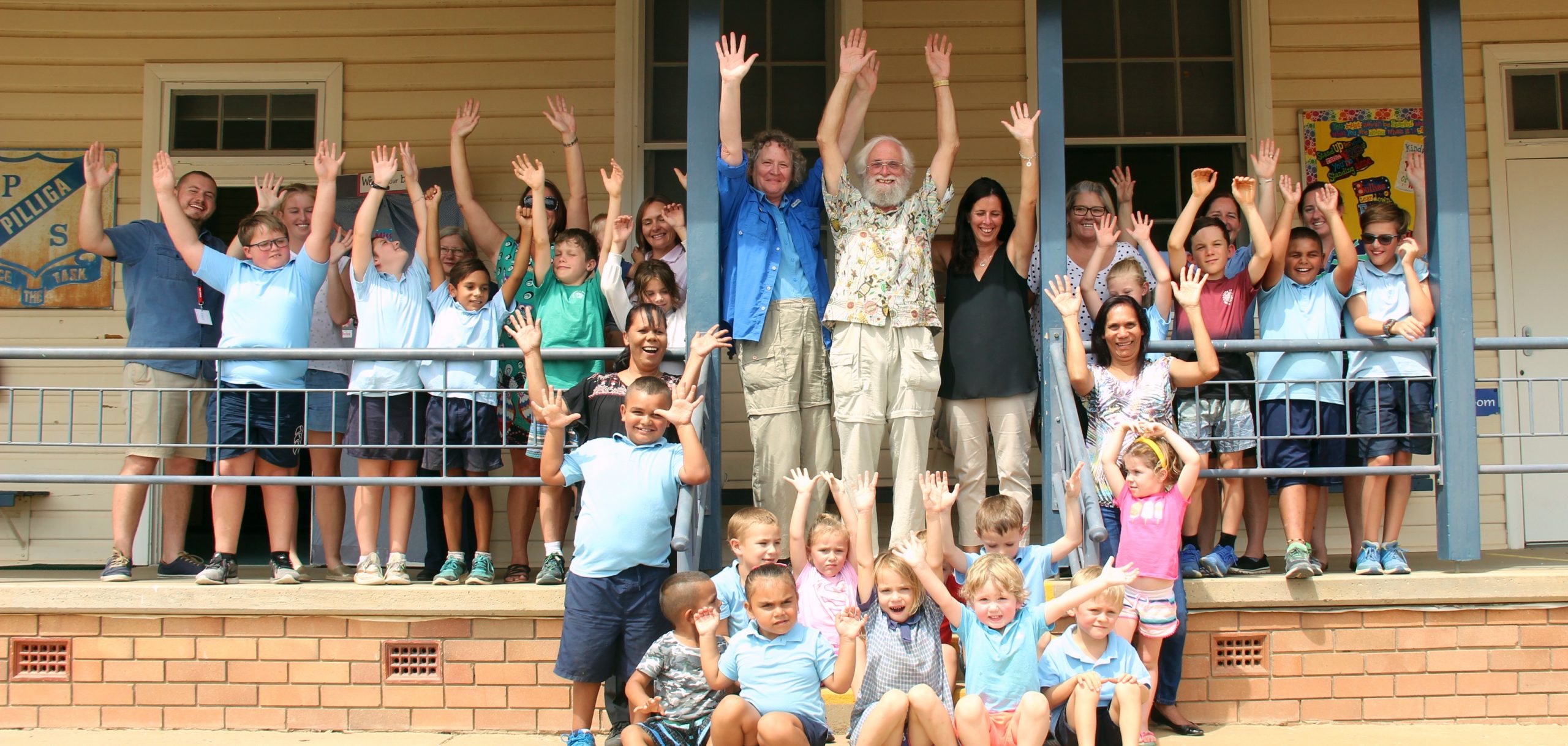 Pilliga Public School was delighted to welcome back American teacher, Mr Charlie Jackson who taught at the school during the 1970s. Pictured, back, toy librarian Josh Pattison, teacher Georgina Wanford, health nurse Helen Haire, teacher Shelley Keenan, playgroup student Bryce Steele, mum Jodie Steele, Mr Jackson’s wife Martha Kline, former Pilliga public school teacher Charlie Jackson, principal Seonaid Stewart, learning support officer Michelle Phelps, administration manager Trish Wilkins and administration officer Zoie Fogarty, middle, Bryan Knowles, T’ea Robinson, Jai Doolan, Mikey Keenan, Harmonie Ruttley, Tyleena Smith, Benny Keenan, Malaye Gray and Tallen Robinson, middle standing, former student and playgroup co-ordinator Frances Doolan, carer, former student Ellen Doolan, front, standing and seated back, Waylen Gray, Jakobi O’Neill, Angela O’Neill, Ryan Steele, Lachlan Smith, Kai-Lee Edwards, seated front, Matthew Gray, Malaya Gray, Malieka Ruttley, Billie Hall and Jeremy Steele. Absent, Ellie-May Ruttley and Claire Wilkins.