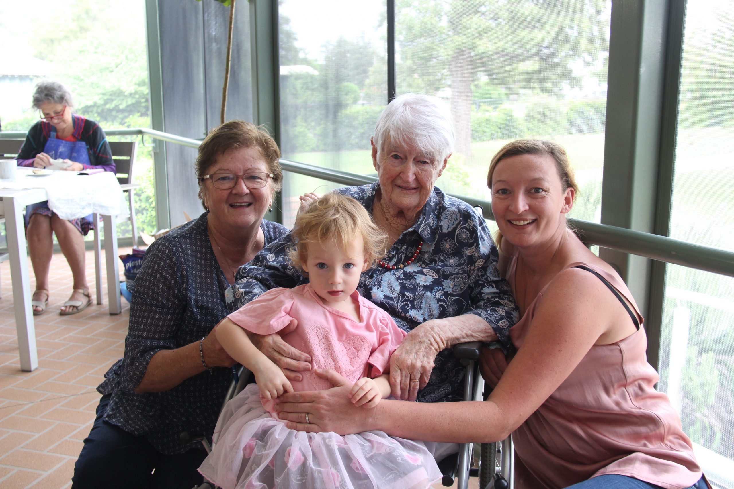 Mary Avery with her mum Una Galvin who is holding her great-granddaughter Olivia Avery and Olivia’s mum Amanda at Whiddon’s Wee Waa aged care residence for the ‘Holding the past, Handling the future’ art project. These photos were taken before the tightening of COVID-19 restrictions.