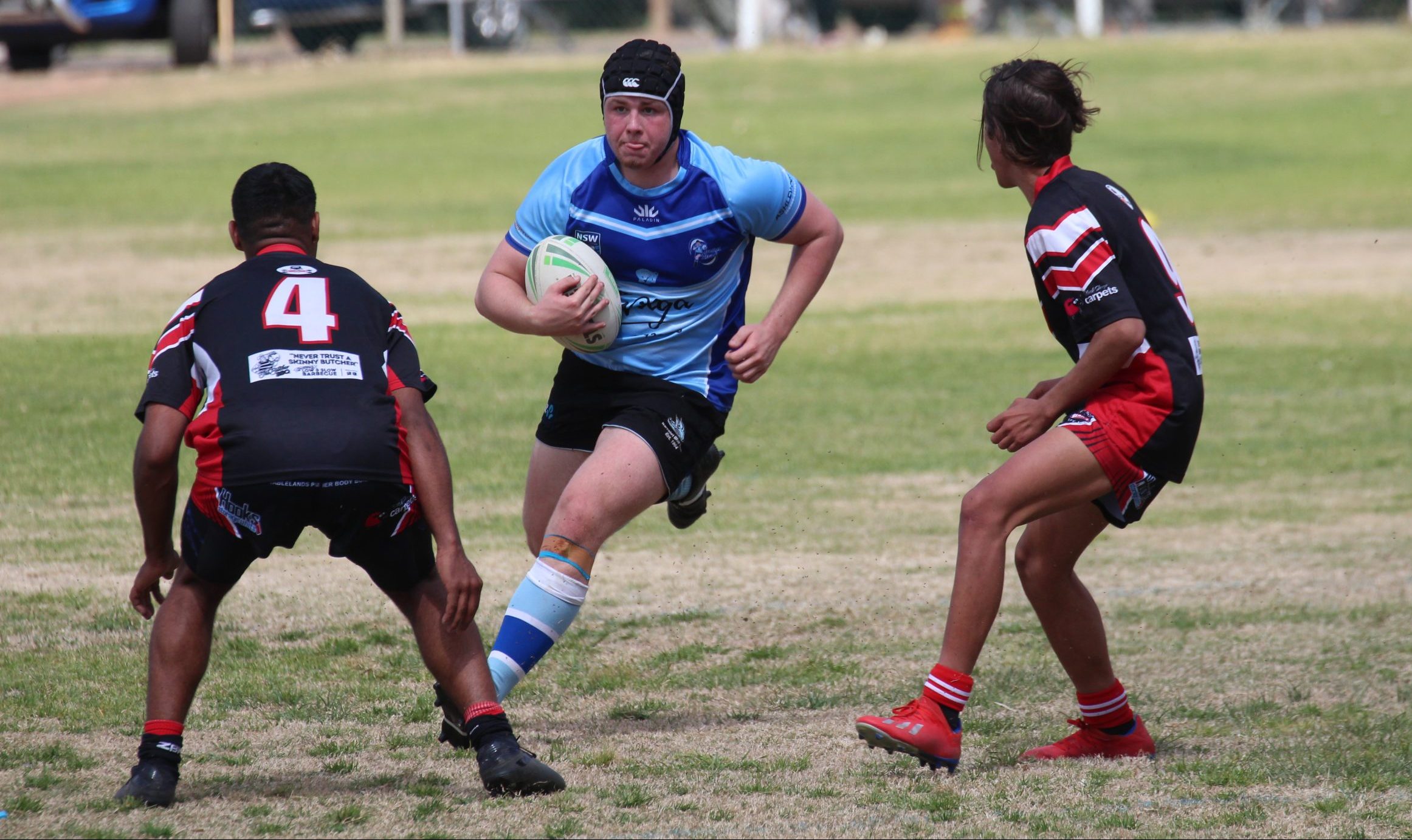 Riley Dickinson (under-16s) charges forward in his team’s win.