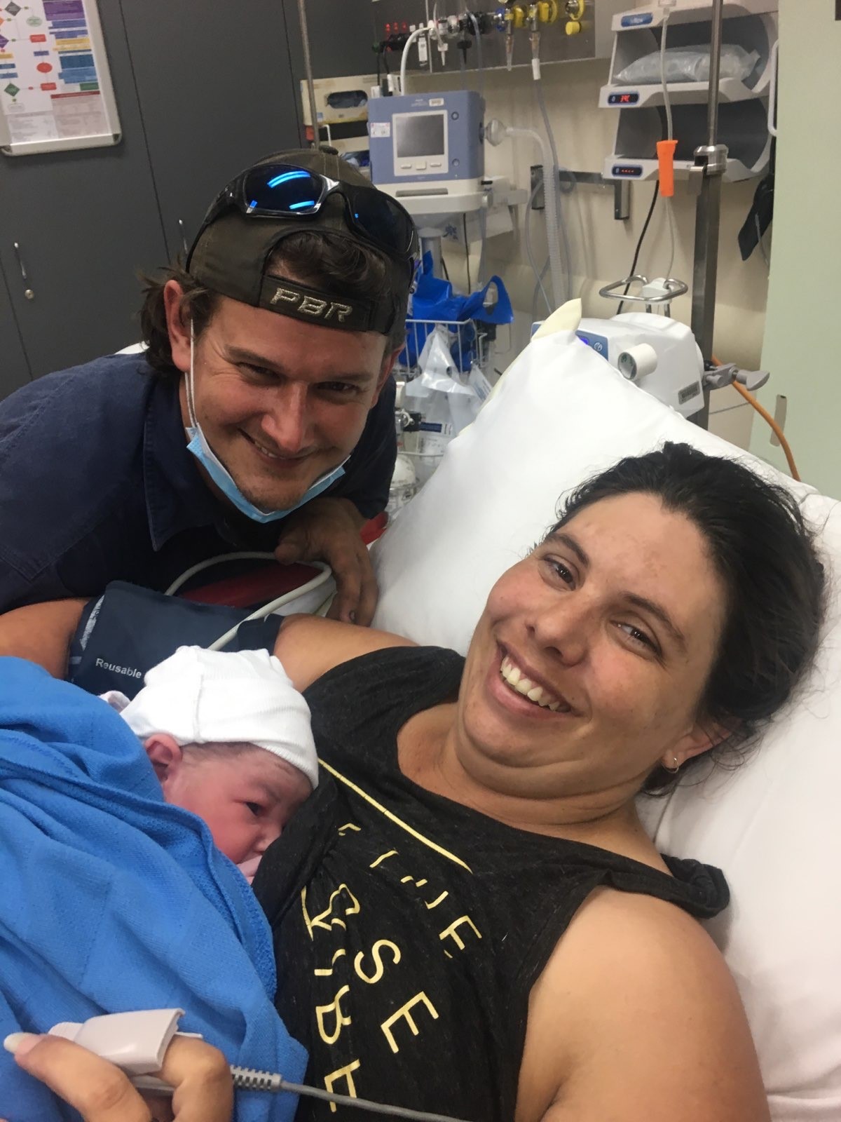 Matthew and Carrie-Anne Carrett hold Vincent after arriving at Narrabri  Hospital following Vincent’s sudden arrival while rushing to hospital between Wee Waa and Narrabri.