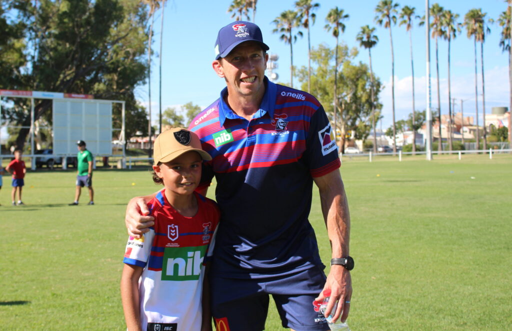 Narrabri and District Junior Rugby League player and Newcastle Knights fan Jarrad Lawler with former Knights captain Kurt Gidley at Collins Park on Tuesday.