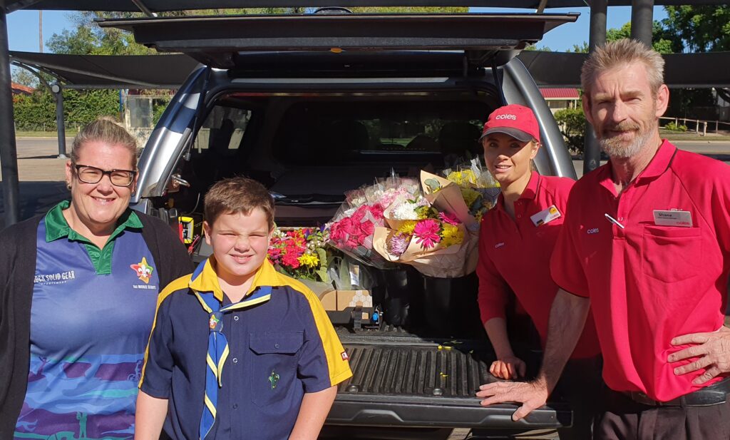 2021flood001 Lauren Townsend and Lucas Bennett with Coles staff Tayla Mills and Shane Gray (Image supplied).