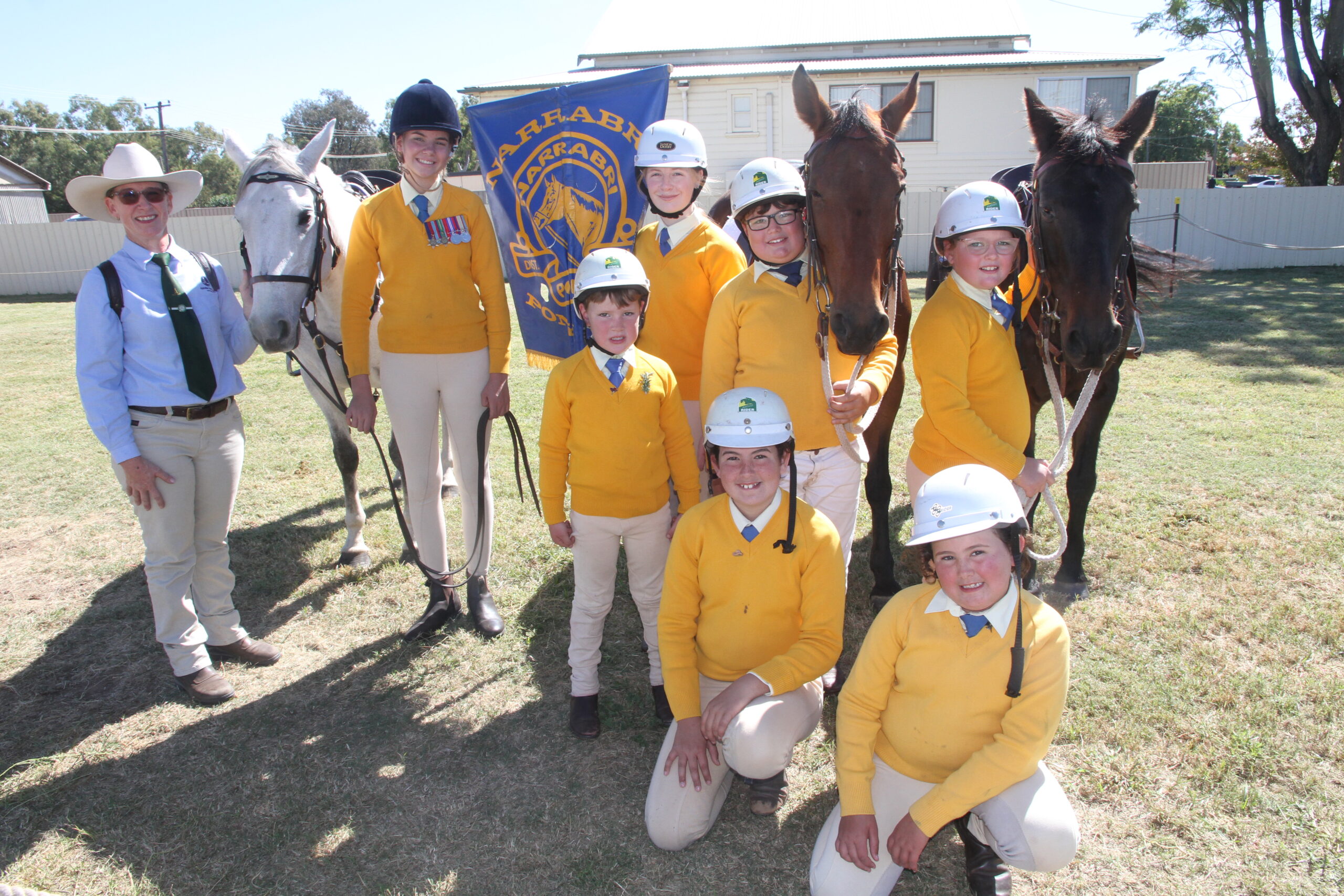 Narrabri Pony Club contingent, senior instructor Kylie Dampney, Piper Williams, Eliza Dampney, Max Booby, Lucy Booby, front, Angus Booby, Isabelle Chappel and Sophie Chappell with horses Freckle, Danny and Josie.