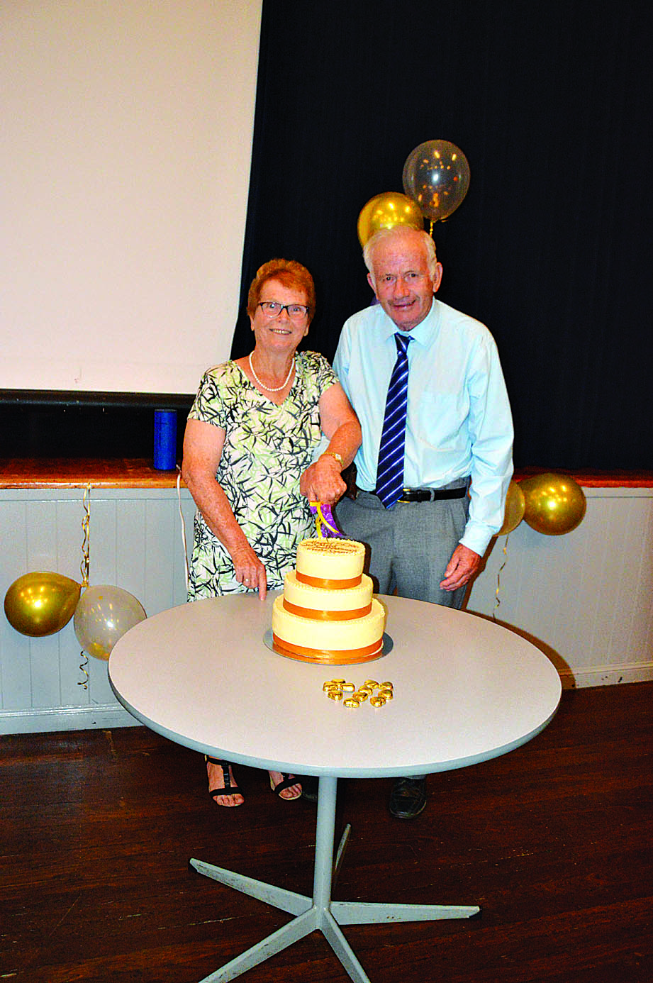 Irene and Fred with their golden wedding anniversary cake.