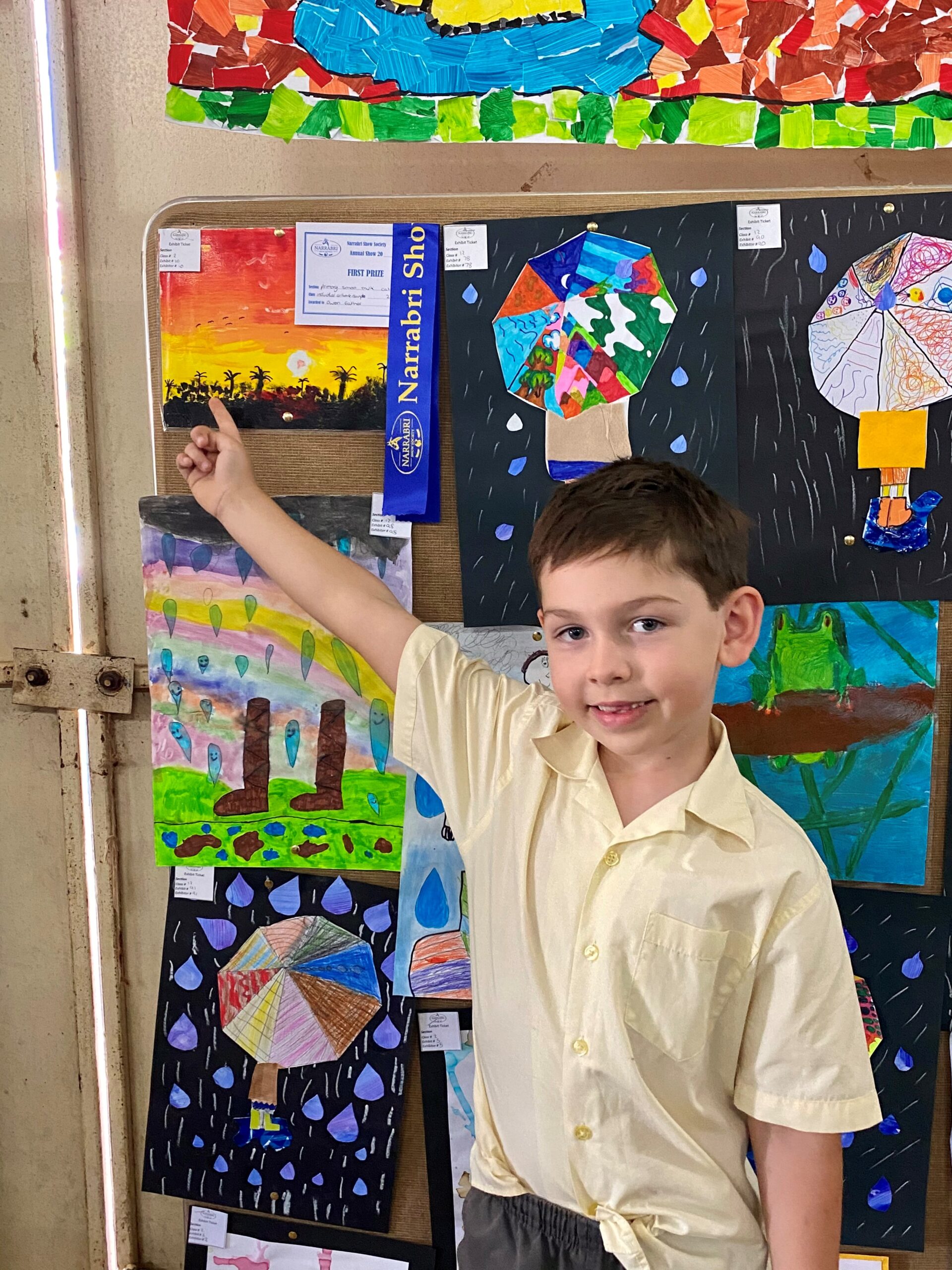 Bellata Public School student Owen Eather points to his artwork which was awarded first prize.