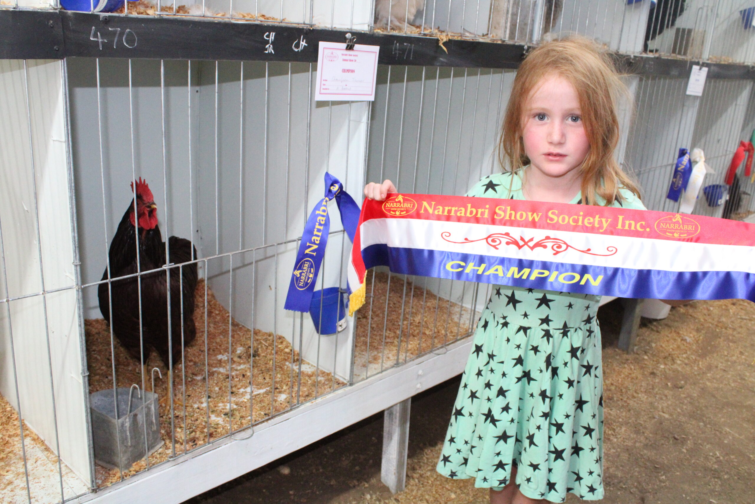 Tully Renaud with her Rhode Island red named Orange Juice which was awarded champion in the junior section in poultry.