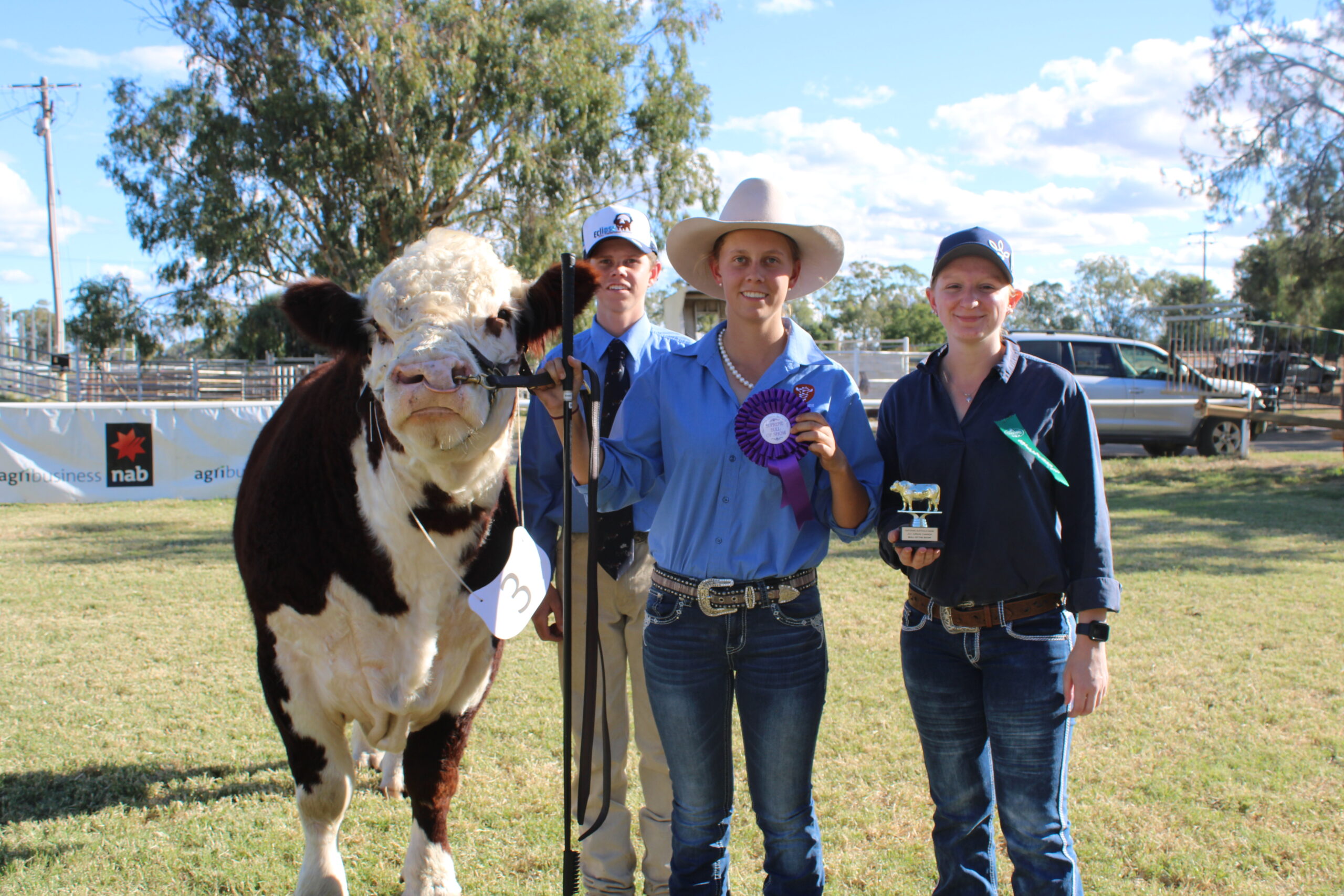 NAB TROPHY: Supreme champion bull of the show was awarded to the Taylor family, Quipolly, for their Hereford, Eclipse Optimus Prime. Pictured are Mitchell and Emily Taylor with Brandi Megson.