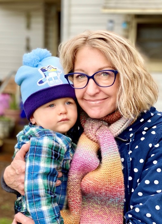 Lisa Almagro holding her grandson Otto Spradbrow.