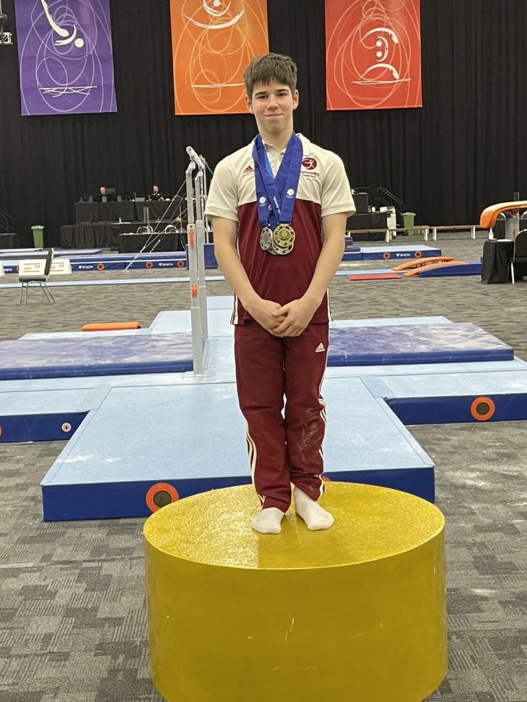 Caedan McIlhatton with his new championship medals. Caedan McIlhatton with his new championship medals.