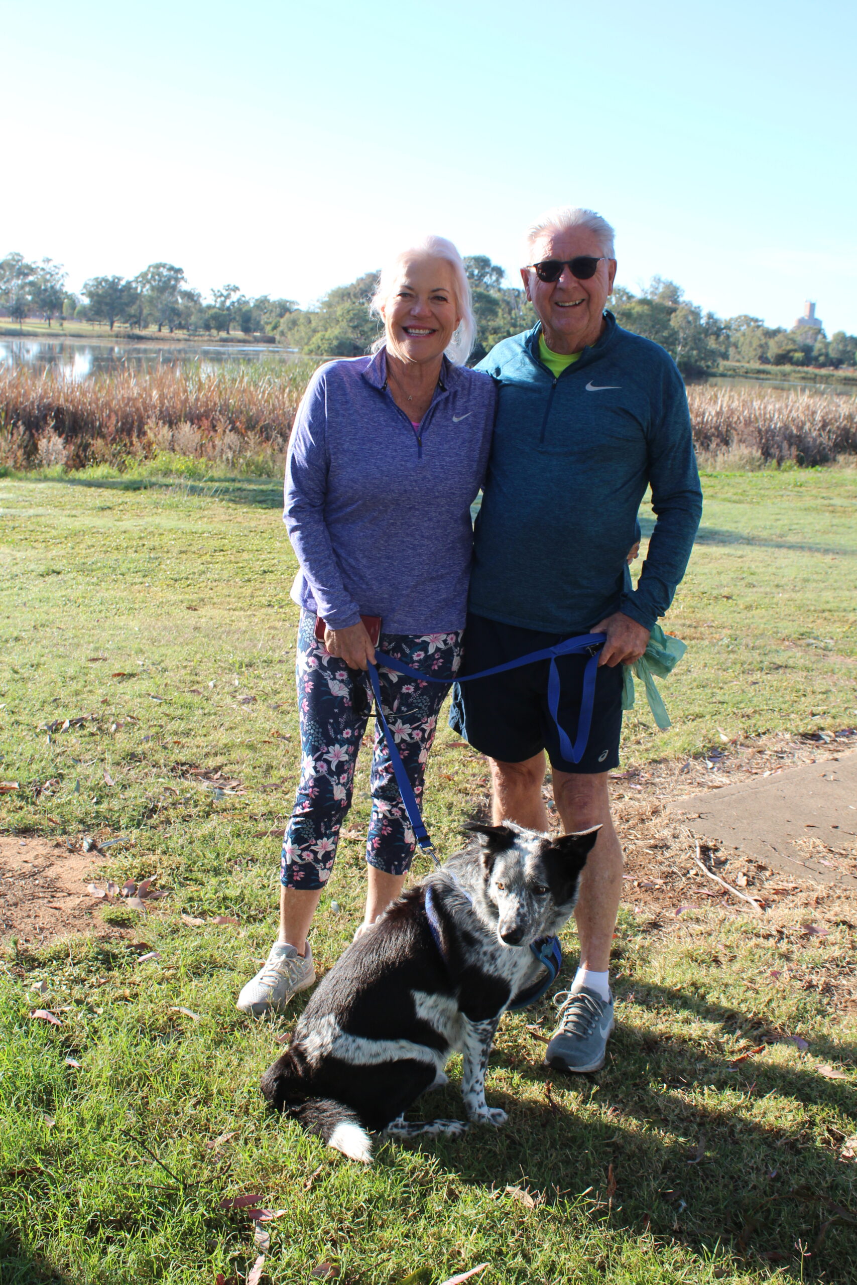 Adrienne Benson and Ray Ross walking Bob.