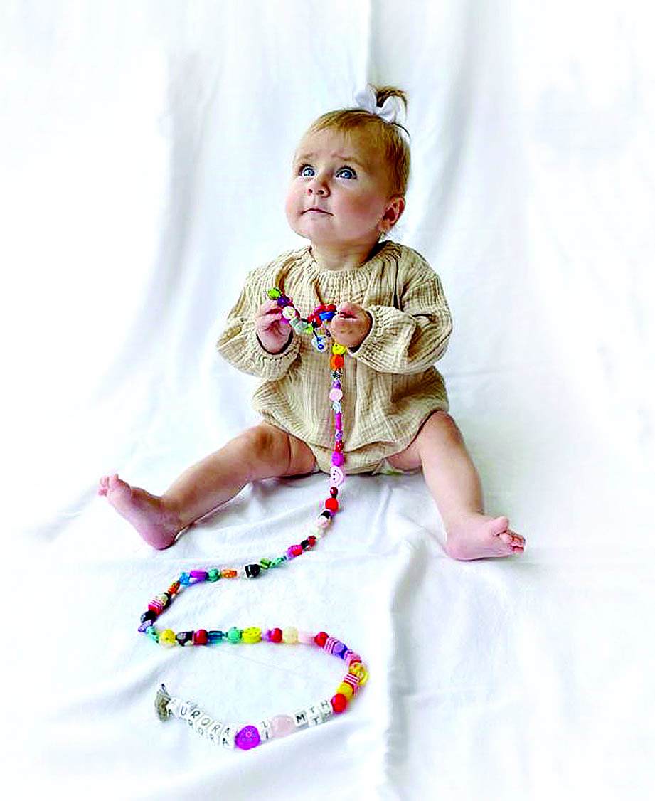Aurora, posterchild for HeartKids. These beads represent all the procedures and milestones along her heart journey to recovery.