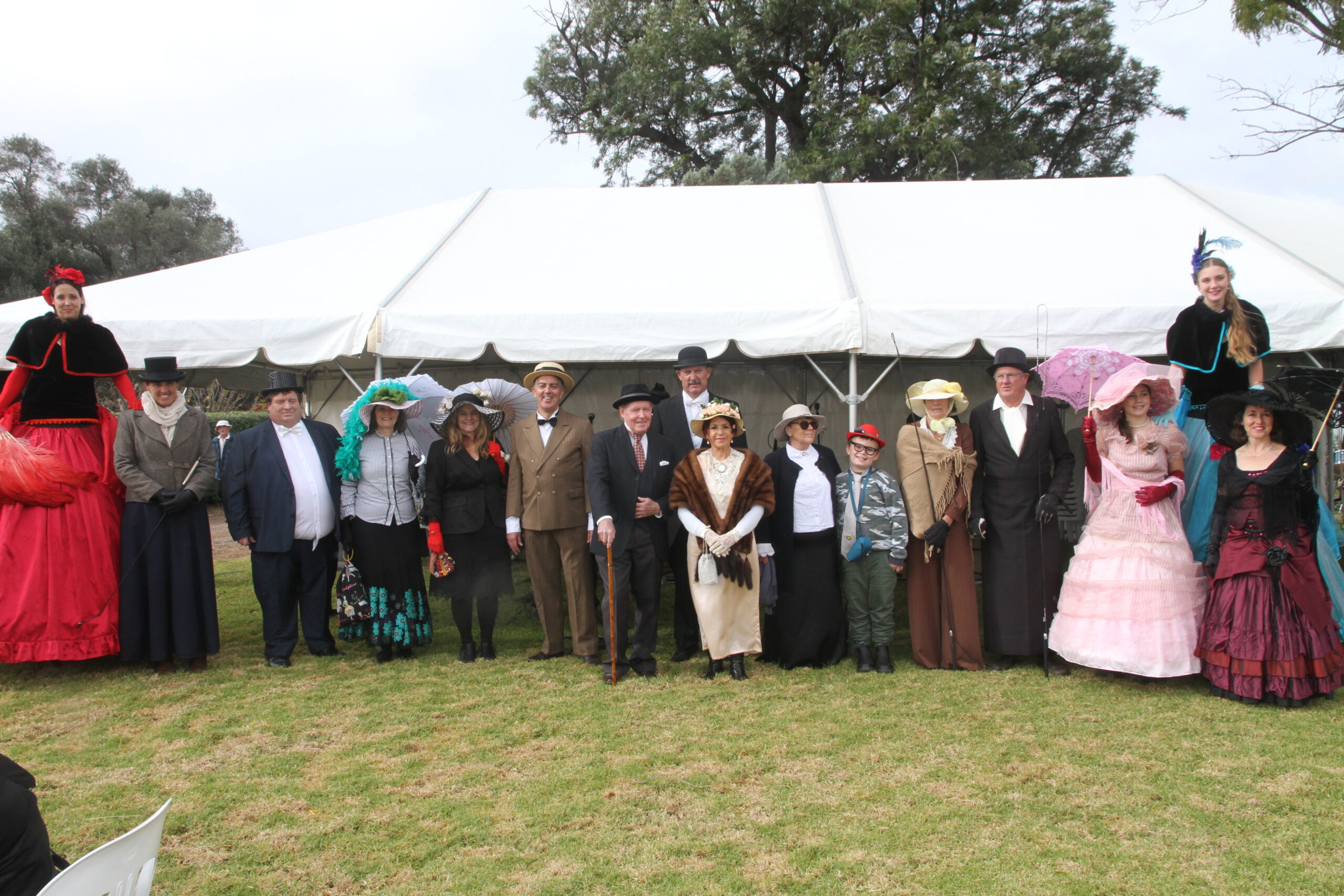 Edwardian-themed outfits were the dress of the day for many at the Kurrumbede open day on Saturday. From left, stilt walker Clare Rourke, winner of the best dressed female title Anthea Guest, best dressed male Peter Crane, Victoria Crane, Sue Jenkins, Andrew Garrett (Whitehaven), Darren Swain (Whitehaven), Sharon Woodham, Tyler Harrison, best dressed couple Val and Steve Lord, best hat winner Georgie Rourke, with stilt walker Freya Raglus and Arwen Walters, front, fashion judges Rod and Mary Browne.