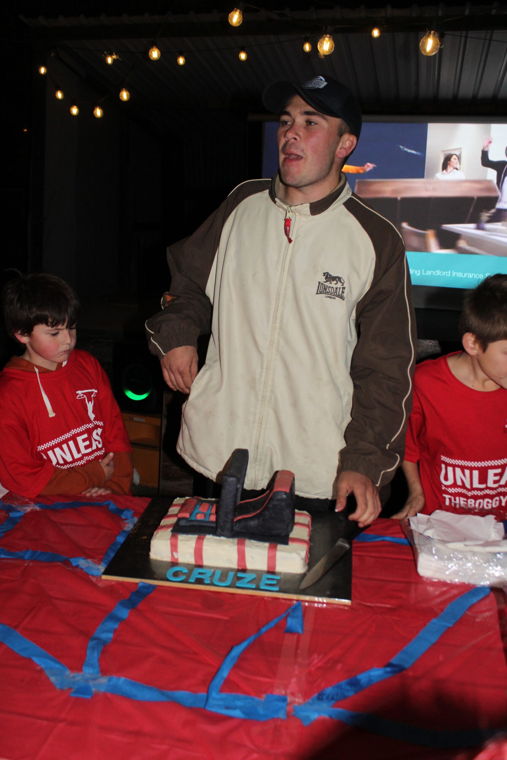 Cruze Morley thanking the crowd and cutting his celebration cake.