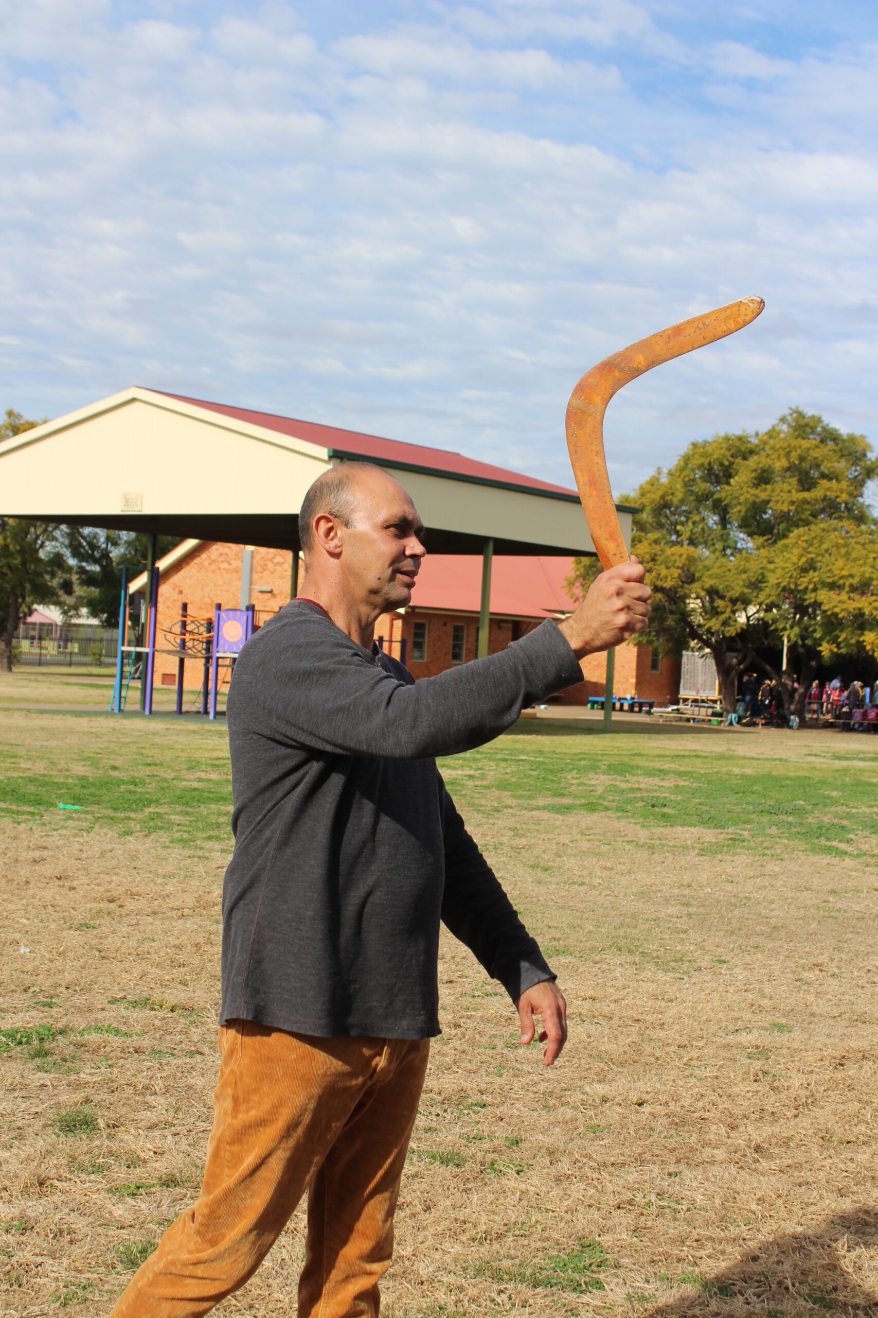 Uncle Tom Barker demonstrating boomerang throwing.