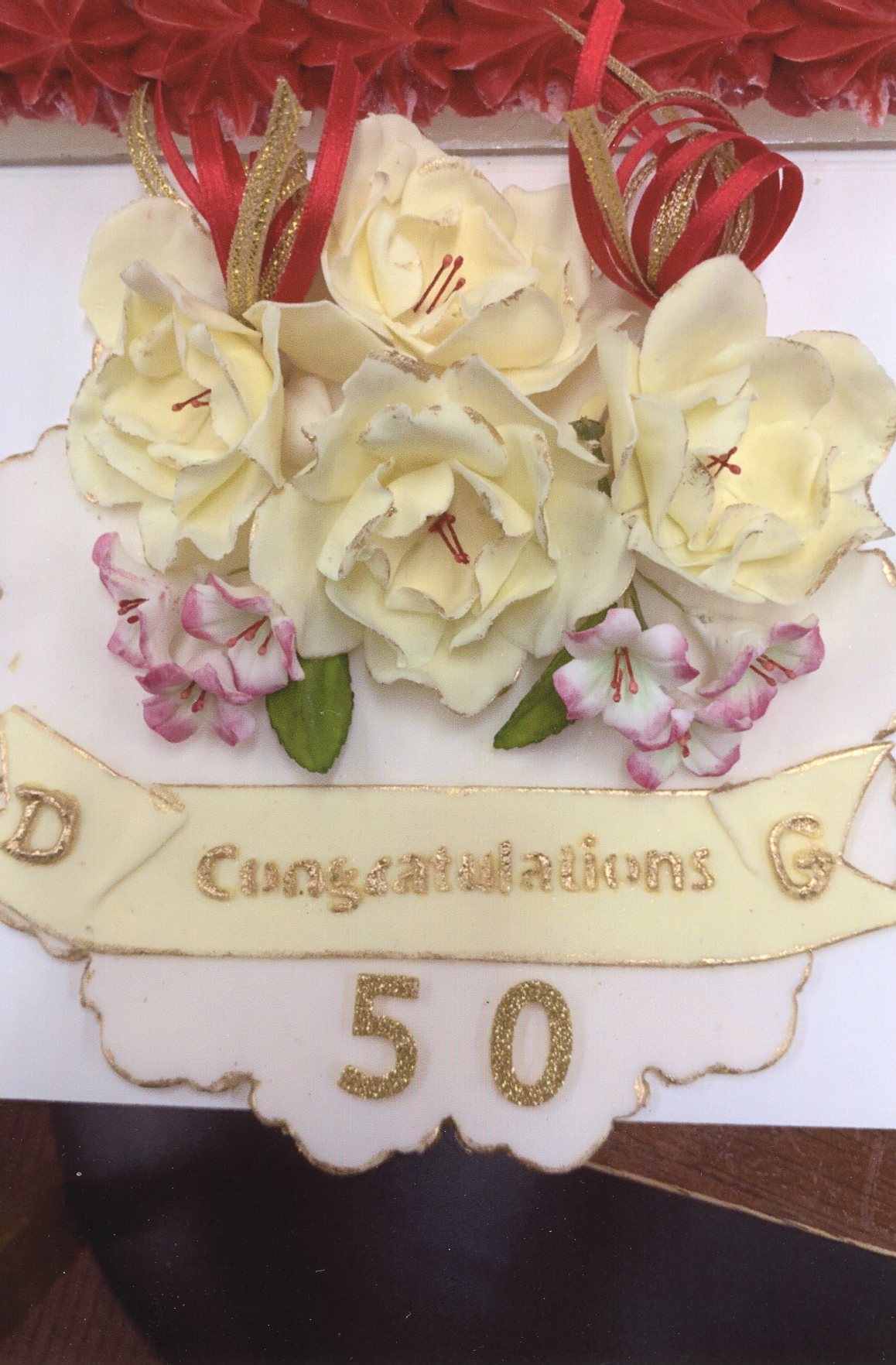 A plaque made with royal fondant icing especially for the 50th celebrations by Dawn Armstrong, who was the original decorator of the couple’s wedding cake 50 years ago.