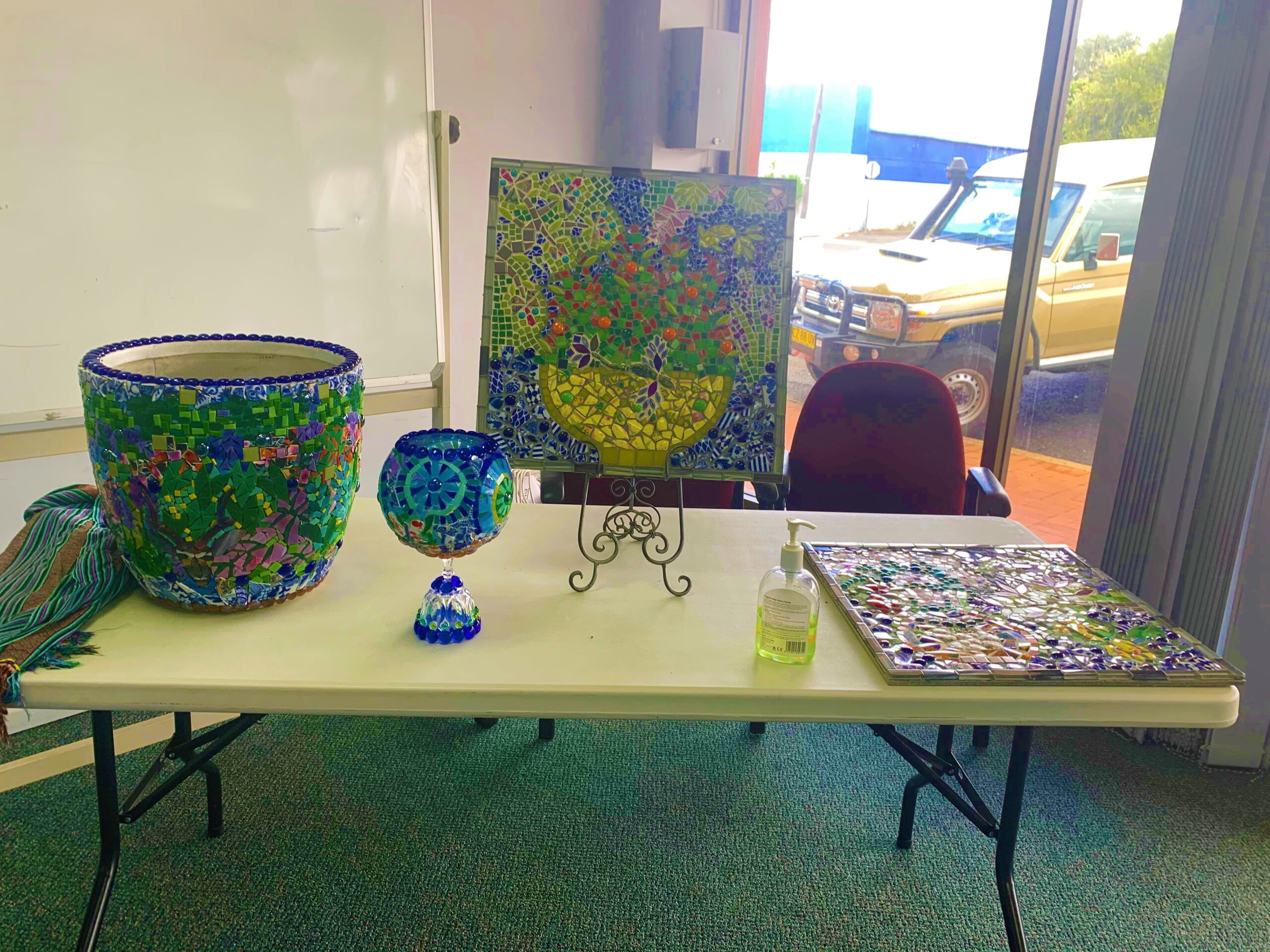 A display of mosaicing instructor Awan Eveleigh’s mosaic pieces.