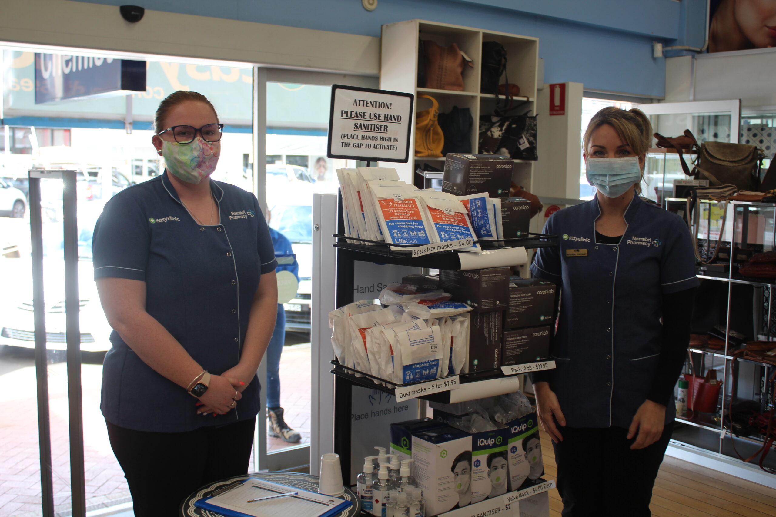 Pheobe Schwager and Kim Campbell by Karen Carter’s display of COVID products, right by the shop’s front door.