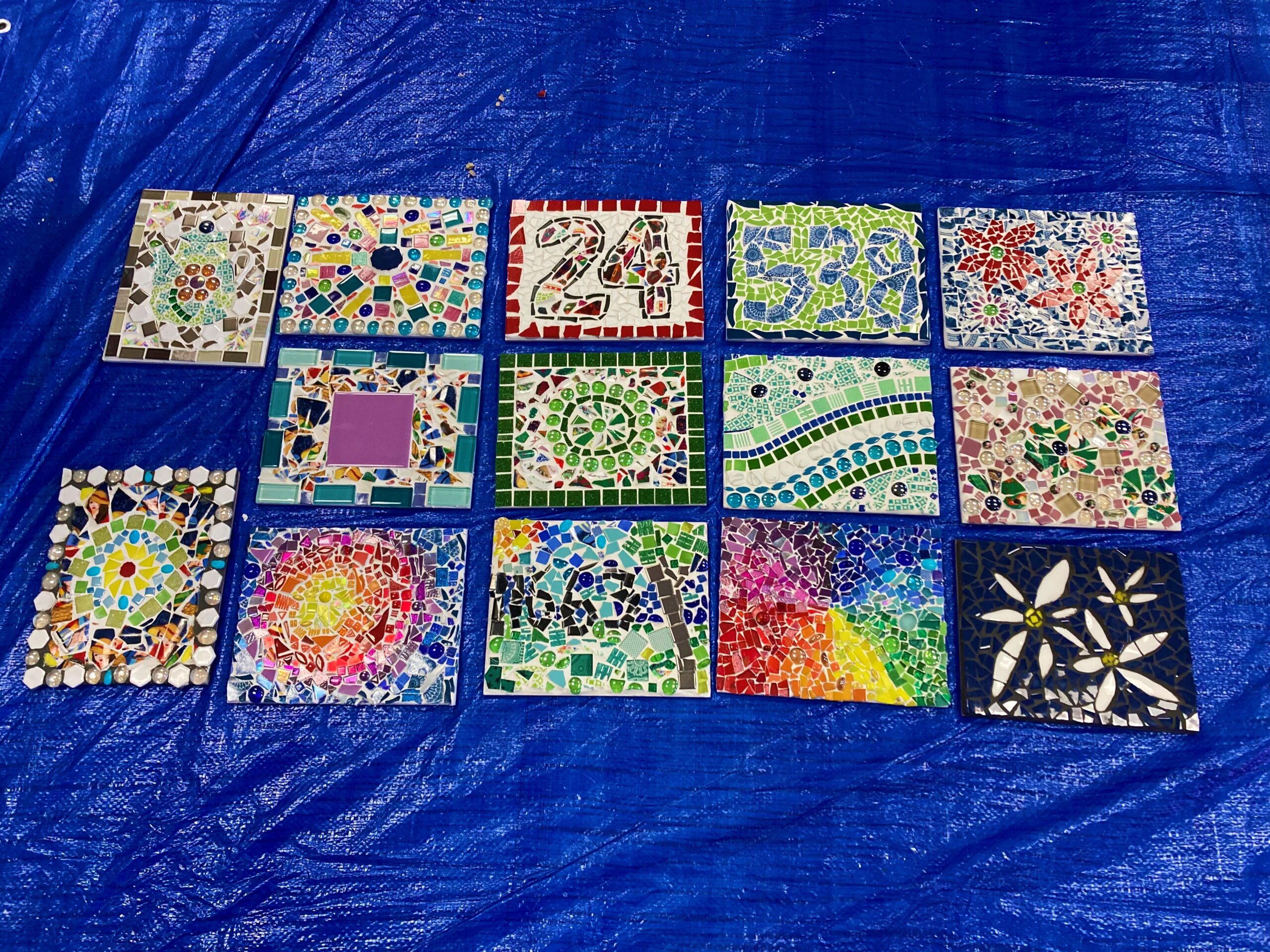 Participants of the mosaicing workshop’s completed works.