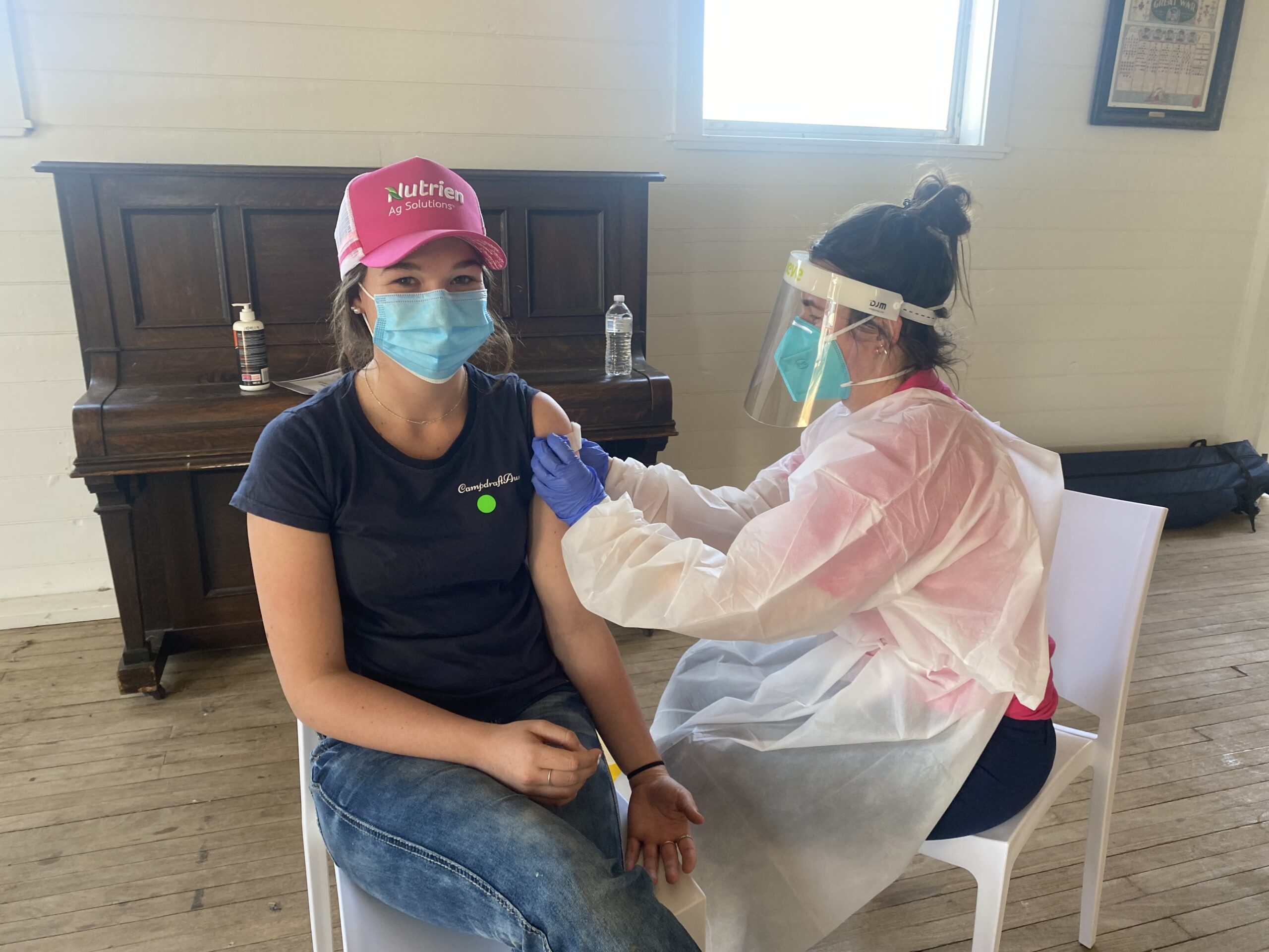 Year 11 student Chrissy Constable receiving her vaccination by Royal Far West nurse Laura Martin at Burren Junction on Thursday, the clinic was organsied with the help of the CWA.