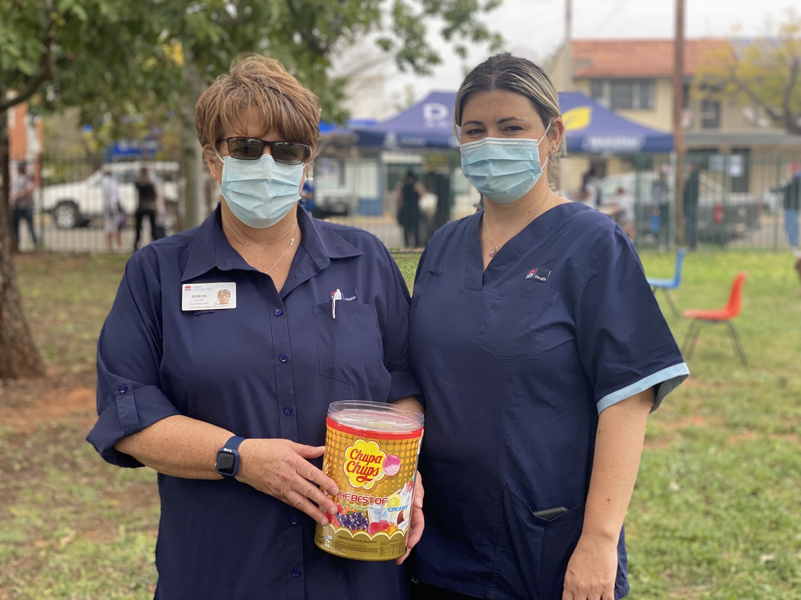 Nurses Robyn Allen and Ammi Russell. Wee Waa Community Hospital nurses made getting the vaccine less painful by kindly offering lollipops.
