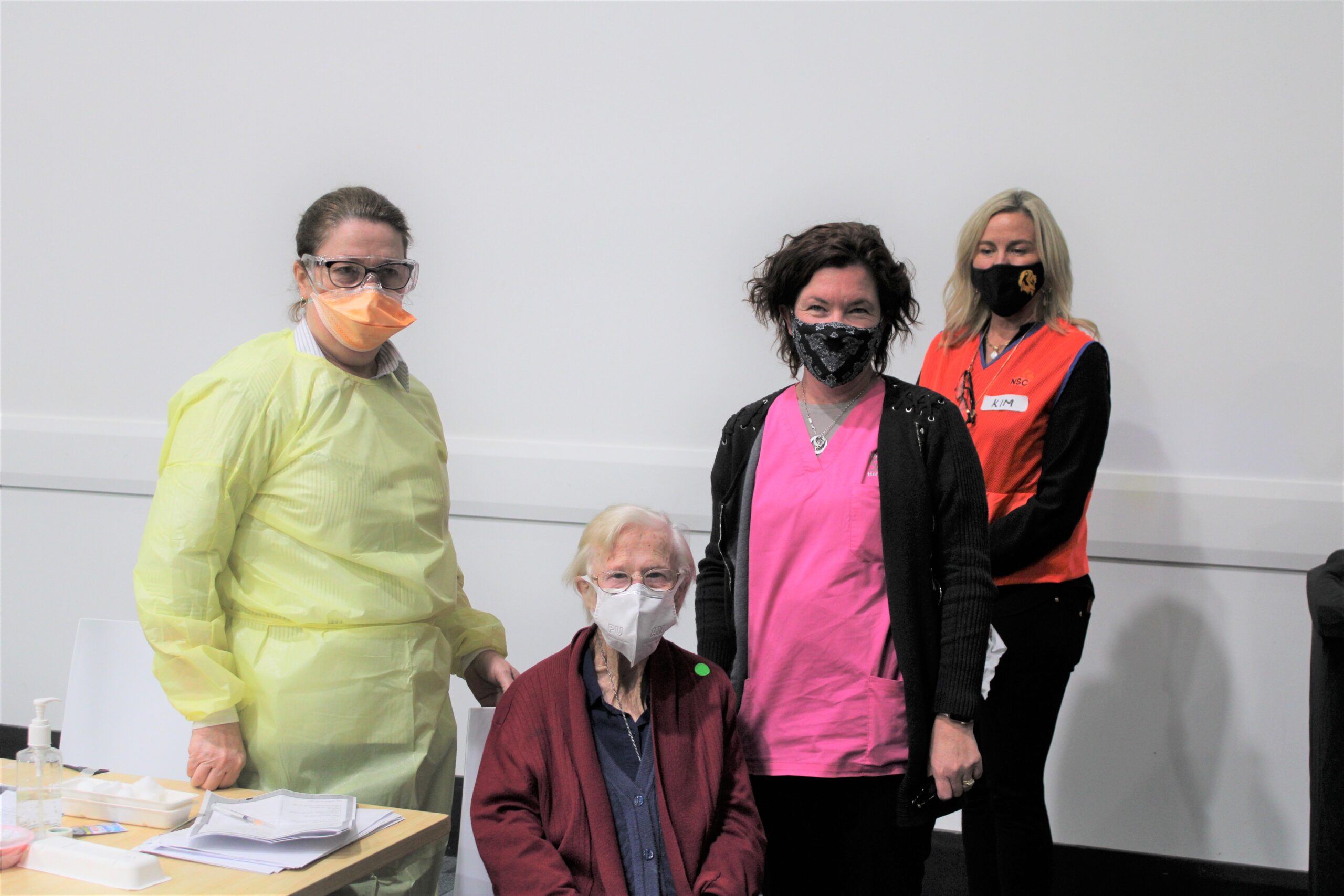 Registered nurse Maxine Ambrose, Onus Hardman, Deanna Parker (Nandebri Home Nursing) and Kim Rozendaal (Rotary volunteer) at the mass vaccination clinic at The Crossing Theatre on Monday, where Onus rolled up her sleeve to receive her COVID vaccination.