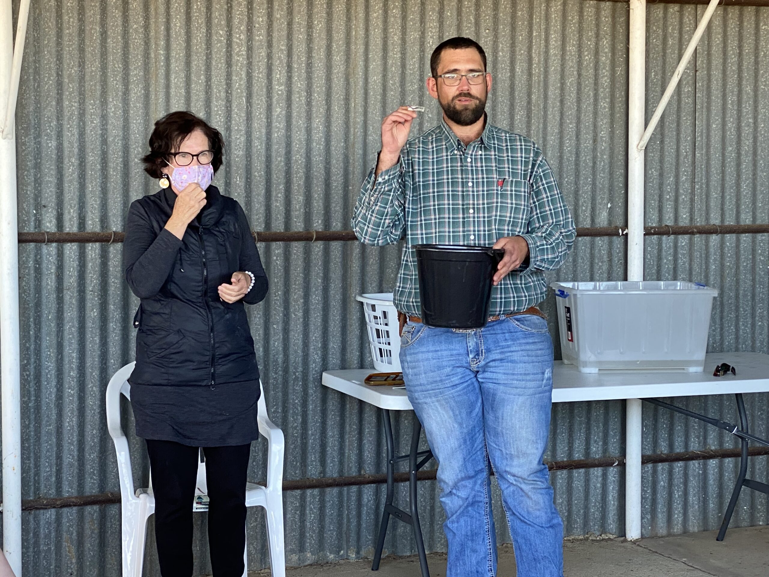 Janelle Schwager and Gary Hibbens drawing the raffle.