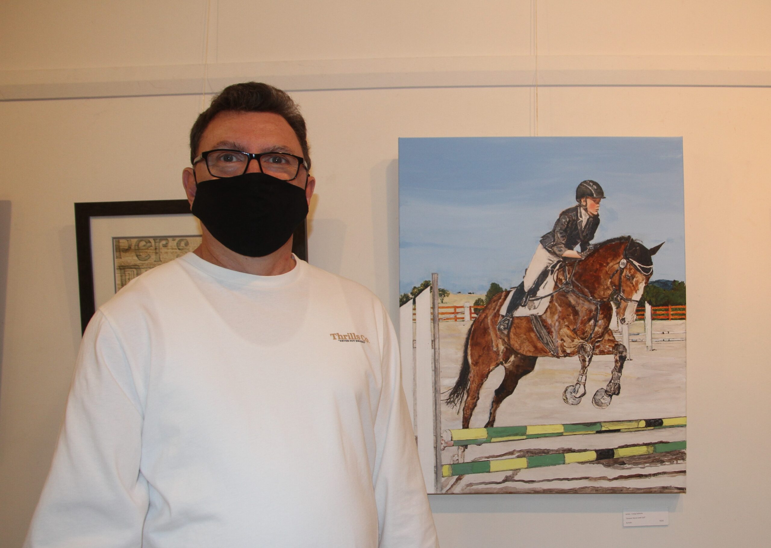 Craig Salmon with his painting ‘Dream Horse and Girl’ in acrylics.