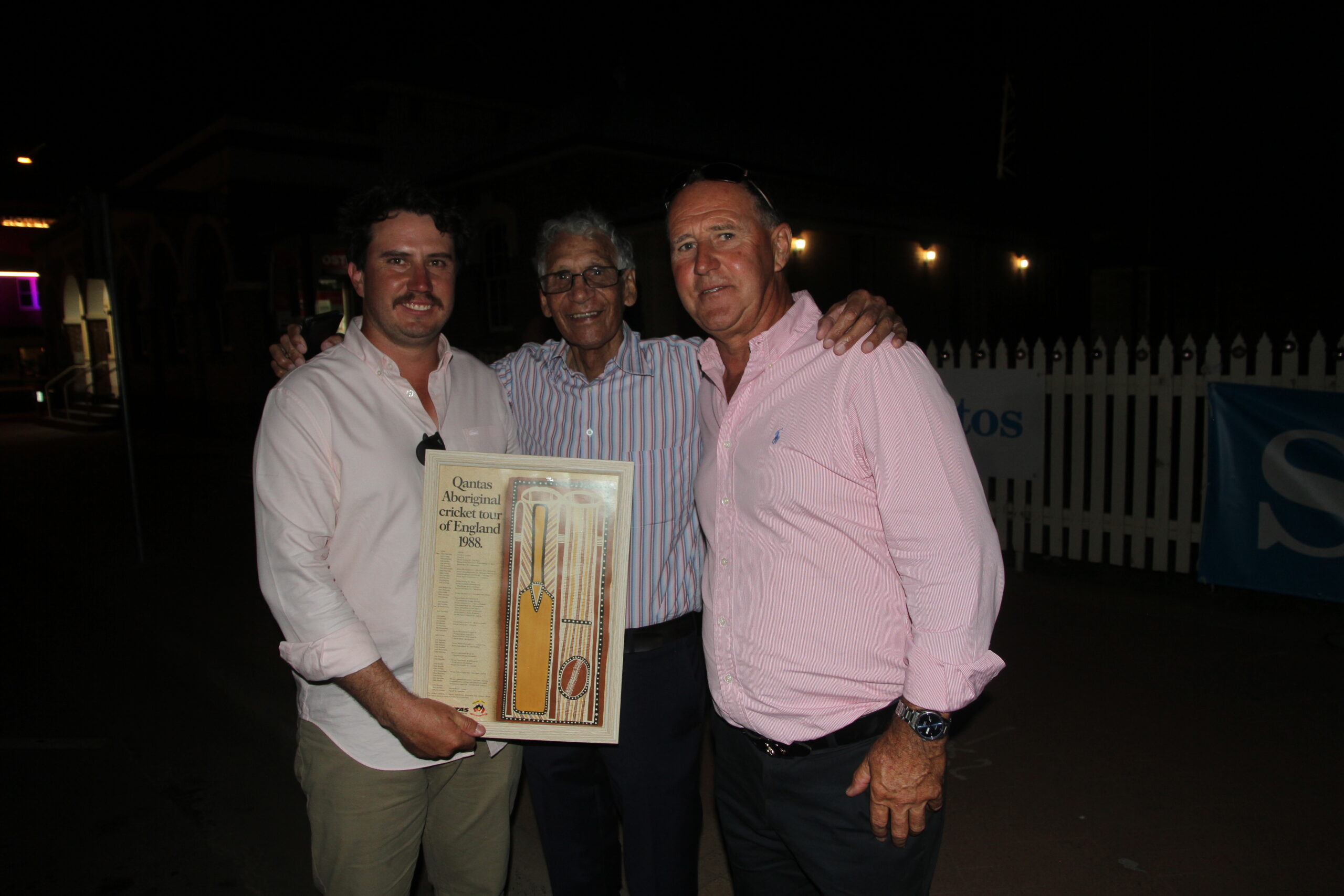 Auction buyers and donors gave generous support to Pink Up event on Saturday night. Les Knox donated a historic poster listing the Aboriginal cricket squad which toured the UK in 1988. Les was a member of the tour. The successful bidder, amid spirited competition, was Nick McClure, left, pictured with Les Knox and Ross McClure.