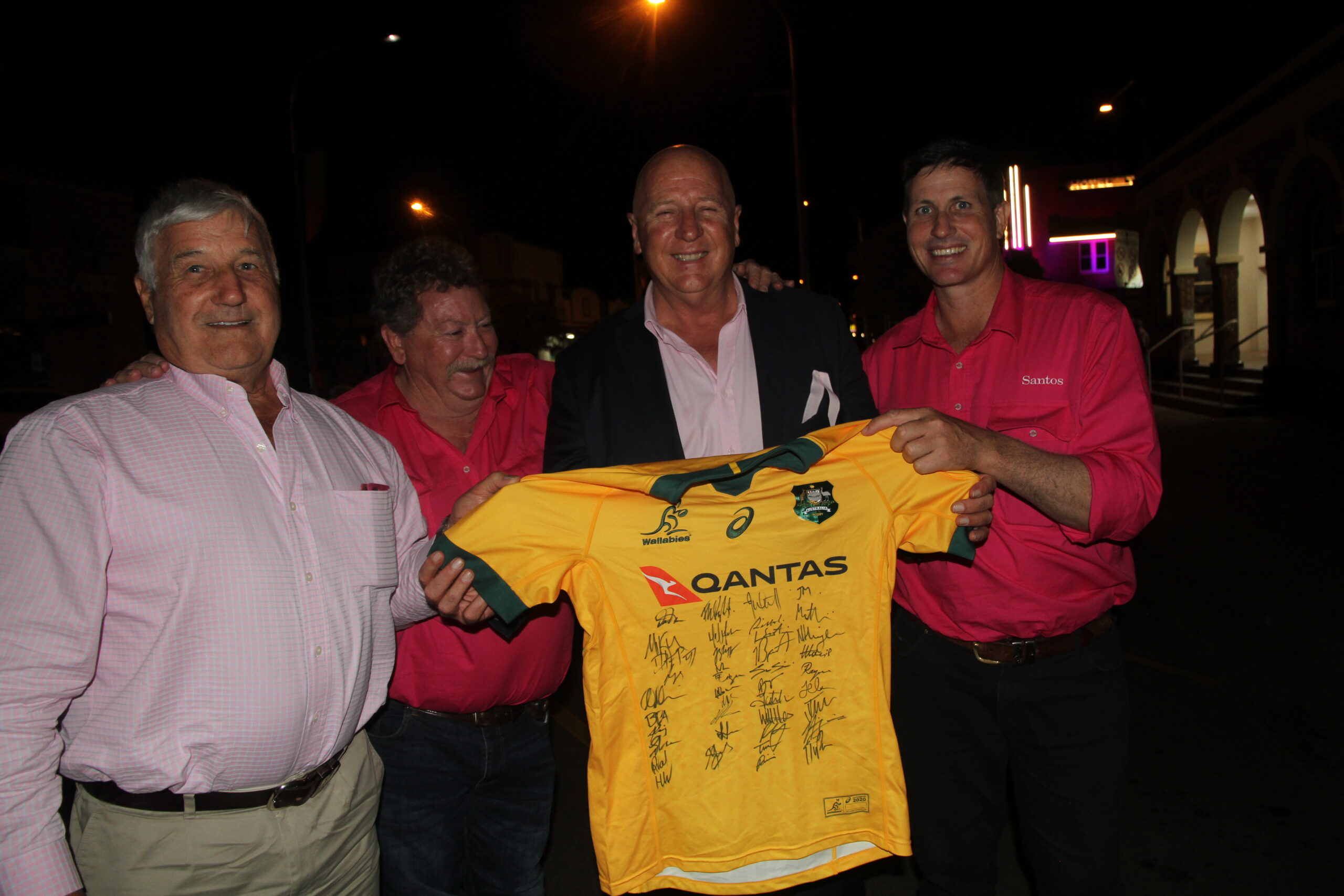 Joint buyers of the Wallabies football jersey auction item, Cr Ron Campey and the mayor Ron Campbell, with auctioneer Rob Gilbert who took the top bid to $1000 for the jersey, the highest auction price on the night. The Wallabies jersey, signed by all the team members, was donated by Santos and presented by Santos regional manager Andrew Snars.