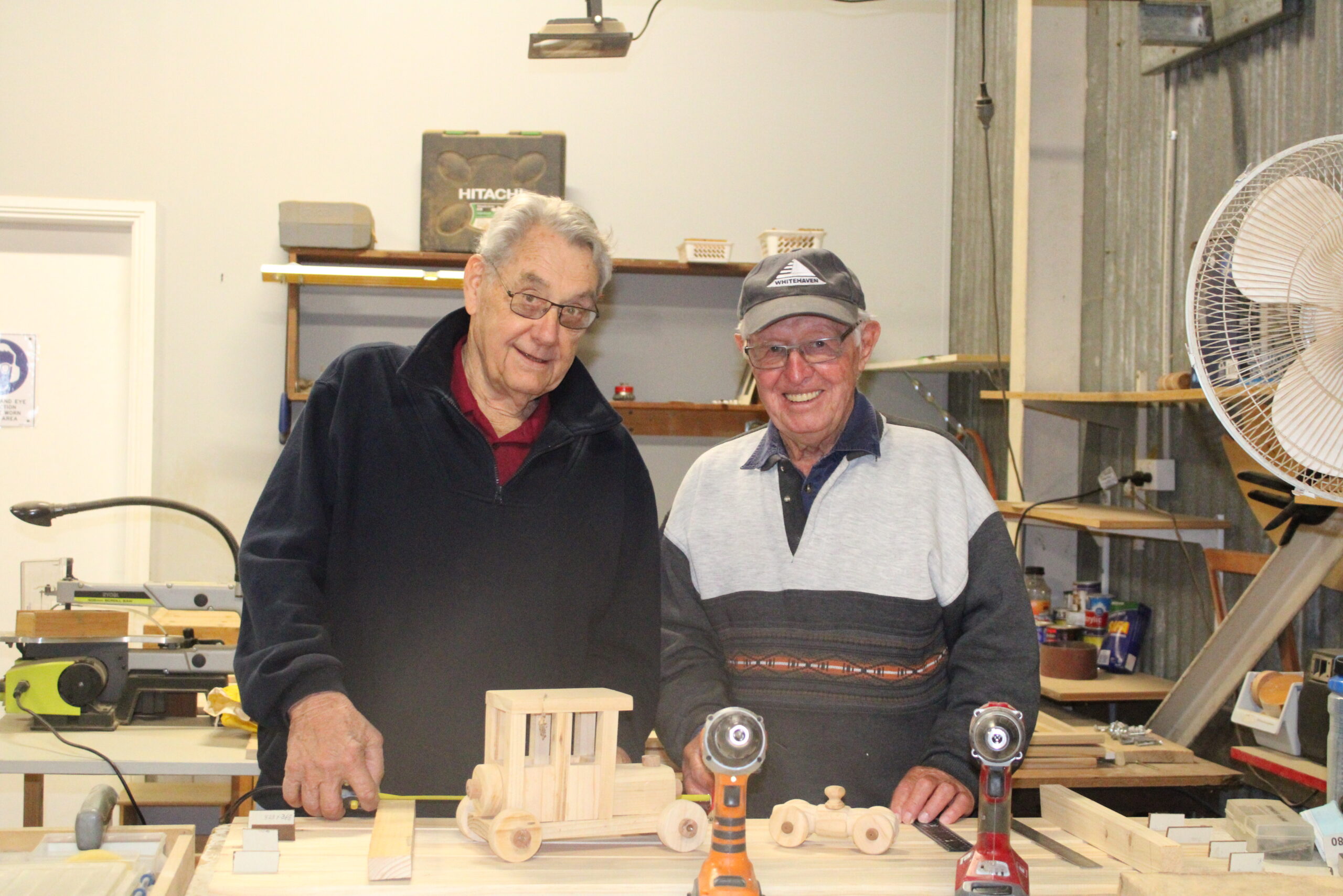 President Peter Hammond with Barry Shepherd in the woodworking room.