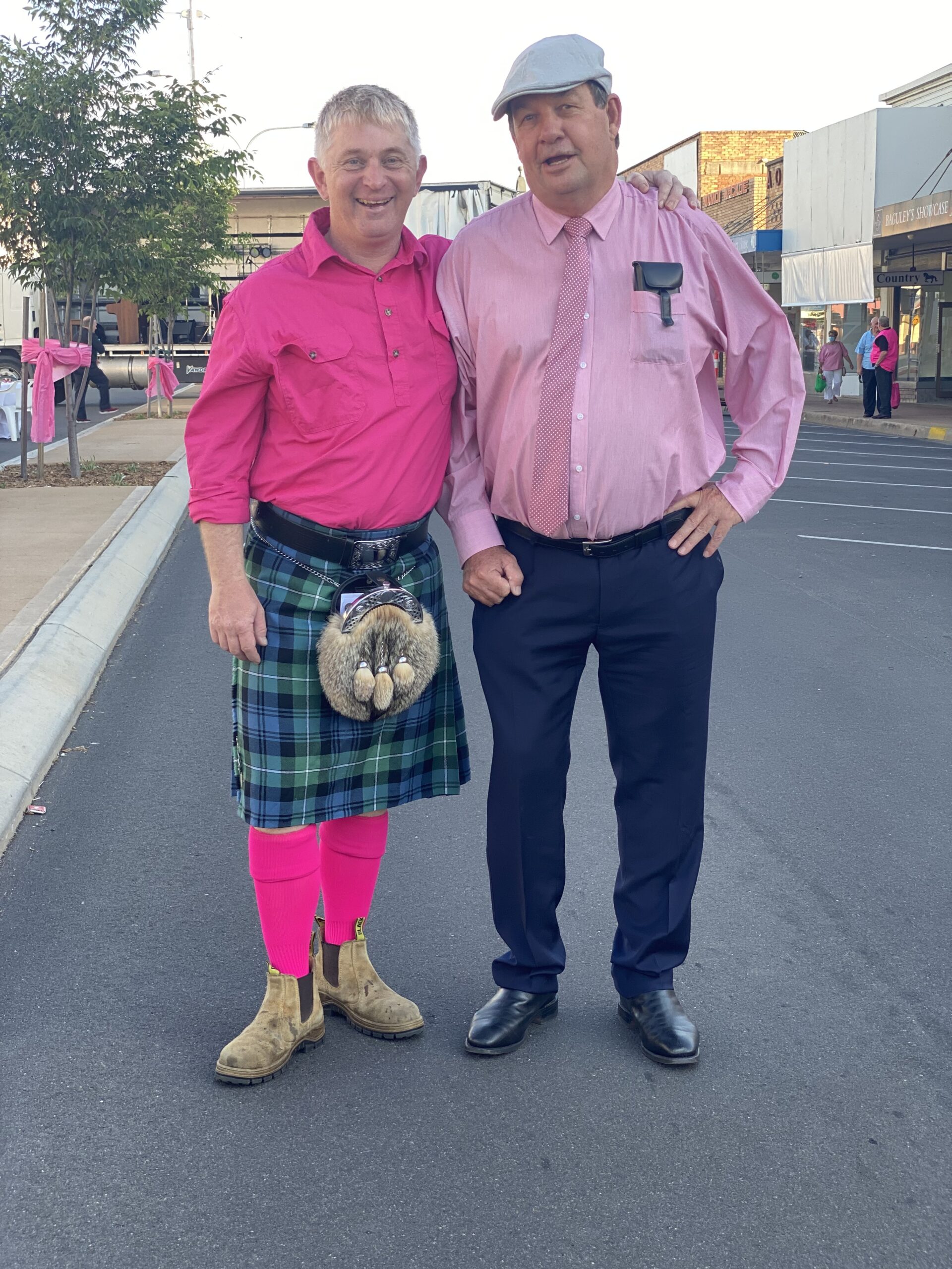 MC for the Pink Up dinner Oliver Knox wearing a kilt and pink combo, with Kerry Watts.