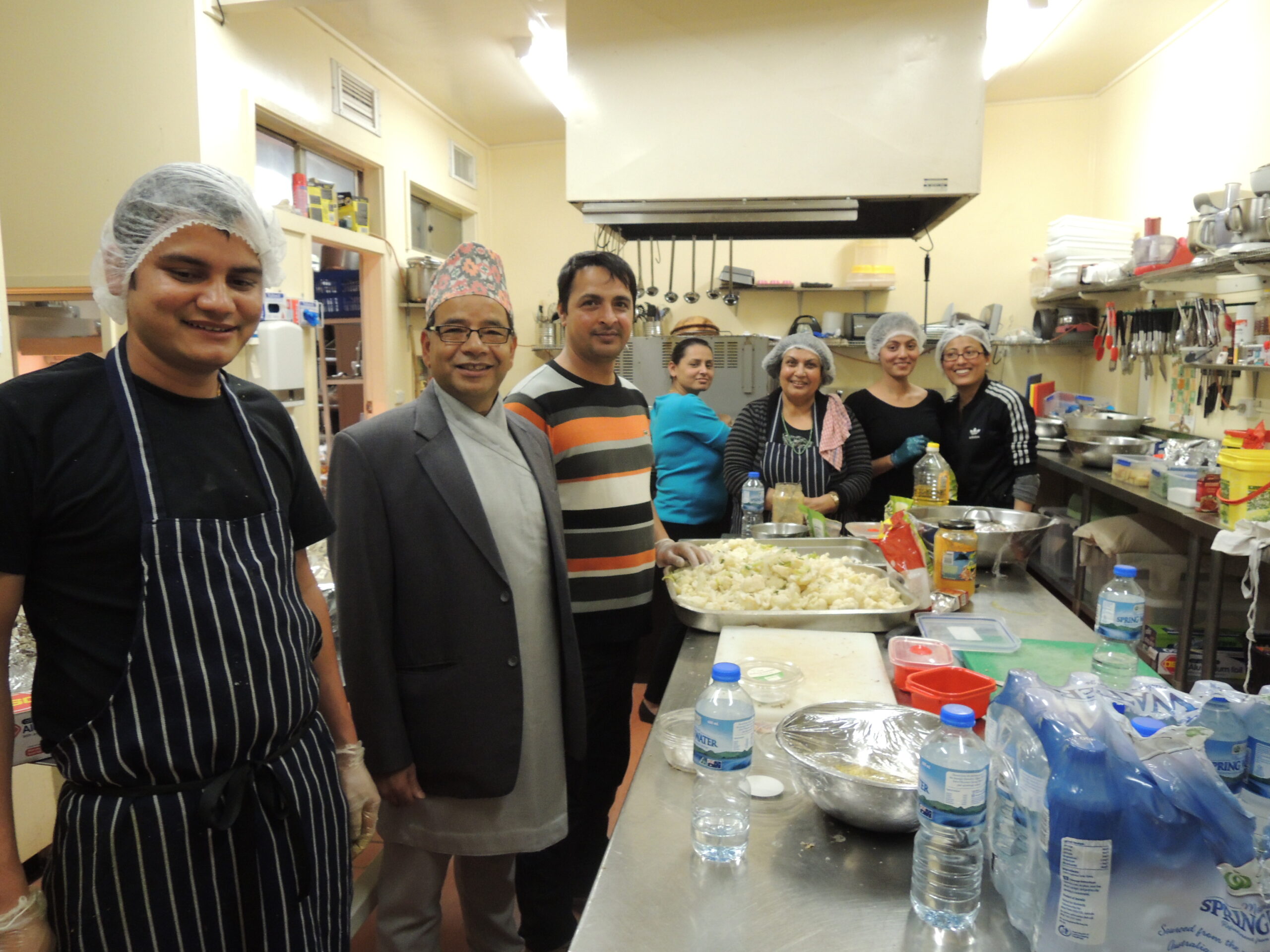 Kedar with a group of Nepalese volunteers preparing food to raise funds for earthquake relief in Nepal.