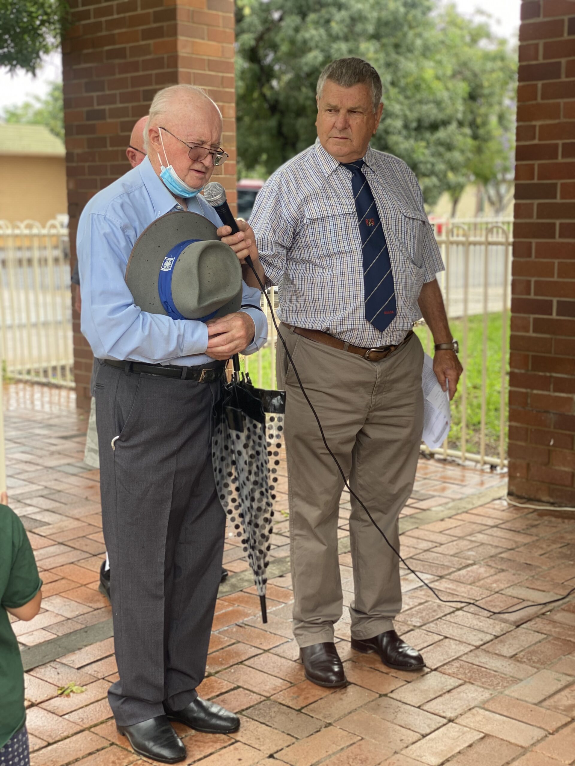 Ex-serviceman David Fry and Dennis Lowder addressing the crowd at Wee Waa’s Remembrance Day service. Many workers and business owners on the main street, stood out the front of their shops at 11am to pause and remember those who have served.