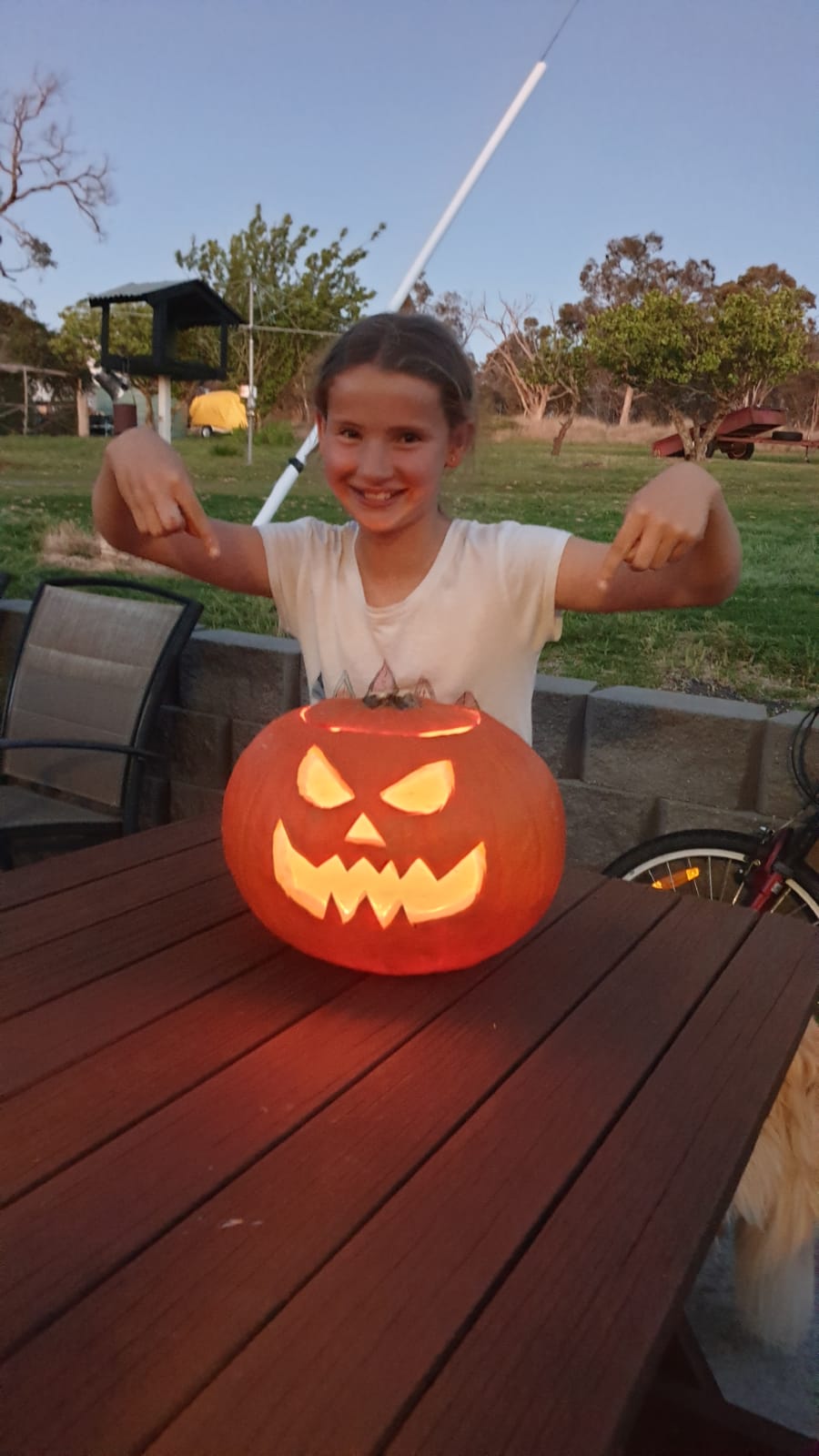 Kara Johnson with the pumpkin she carved.