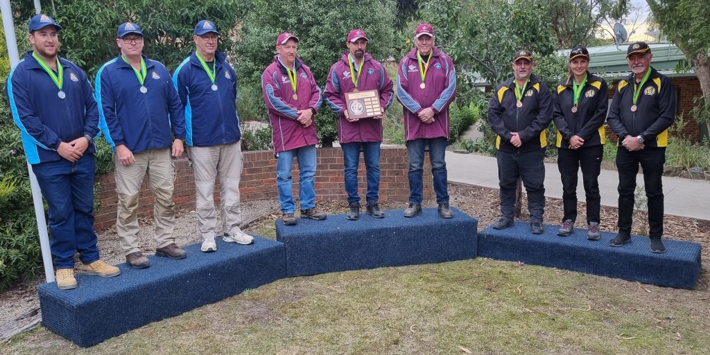Service pistol unrestricted podium finishers - the second-placed NSW team, the winning Queensland team and the third-placed Western Australia team at the 64th Pistol Australia and ISSF National Championships, which were held at Yarra Pistol Club earlier this month. From left to right - Peter Brus, Grahame Keys, Dean Brus, Jamie Longbottom, Brandon Ede, Peter Knowlton, Jeremy Kozak, Linda Jekel and Max Wray. Photo: Supplied
