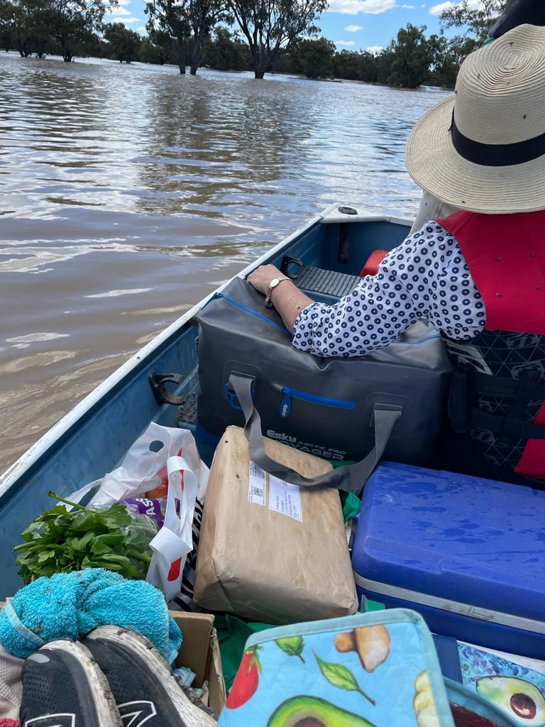 Dedicated BJPS teacher Lucinda Stump traveling to school by boat.